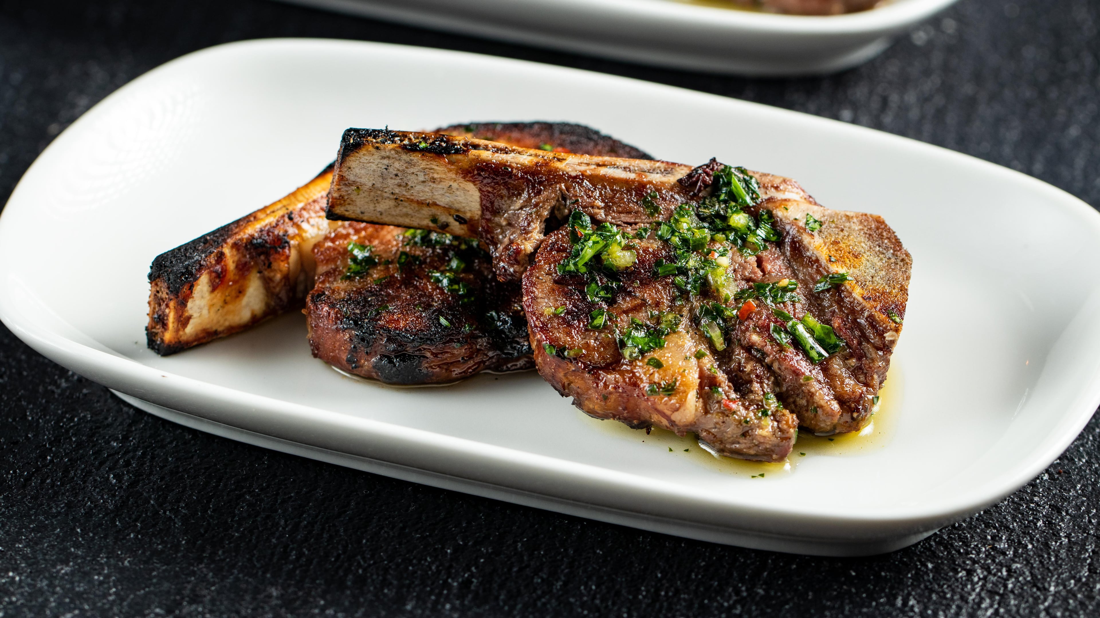 STK Beef Filet Lollipops with Chimichurri Sauce / Courtesy of STK Steakhouse