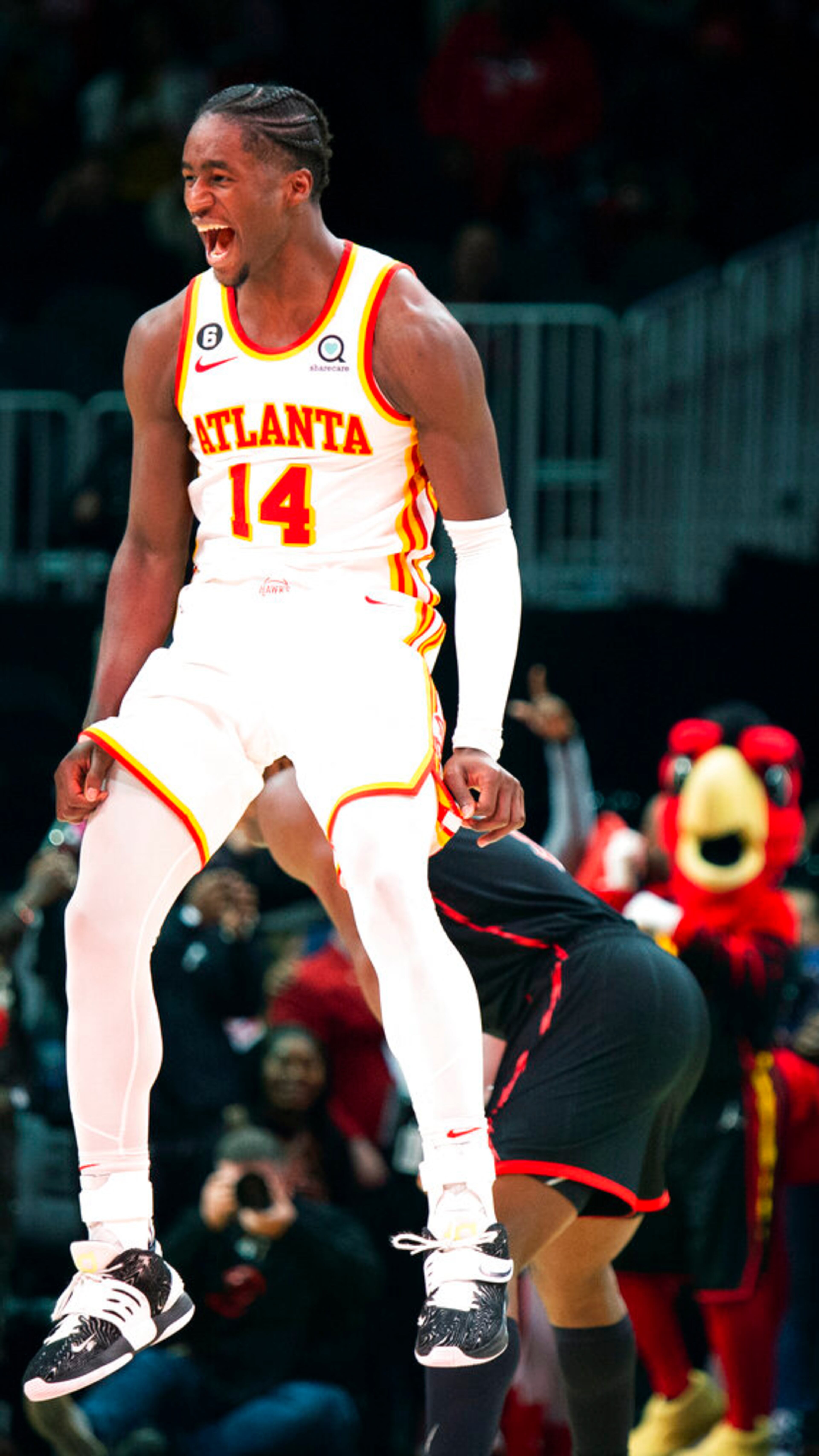 Atlanta Hawks forward A.J. Griffin yells and reacts after making a game-winning shot at the buzzer in overtime against the Toronto Raptors in an NBA basketball game, Saturday, Nov. 19, 2022, in Atlanta. (AP Photo/Hakim Wright Sr.)