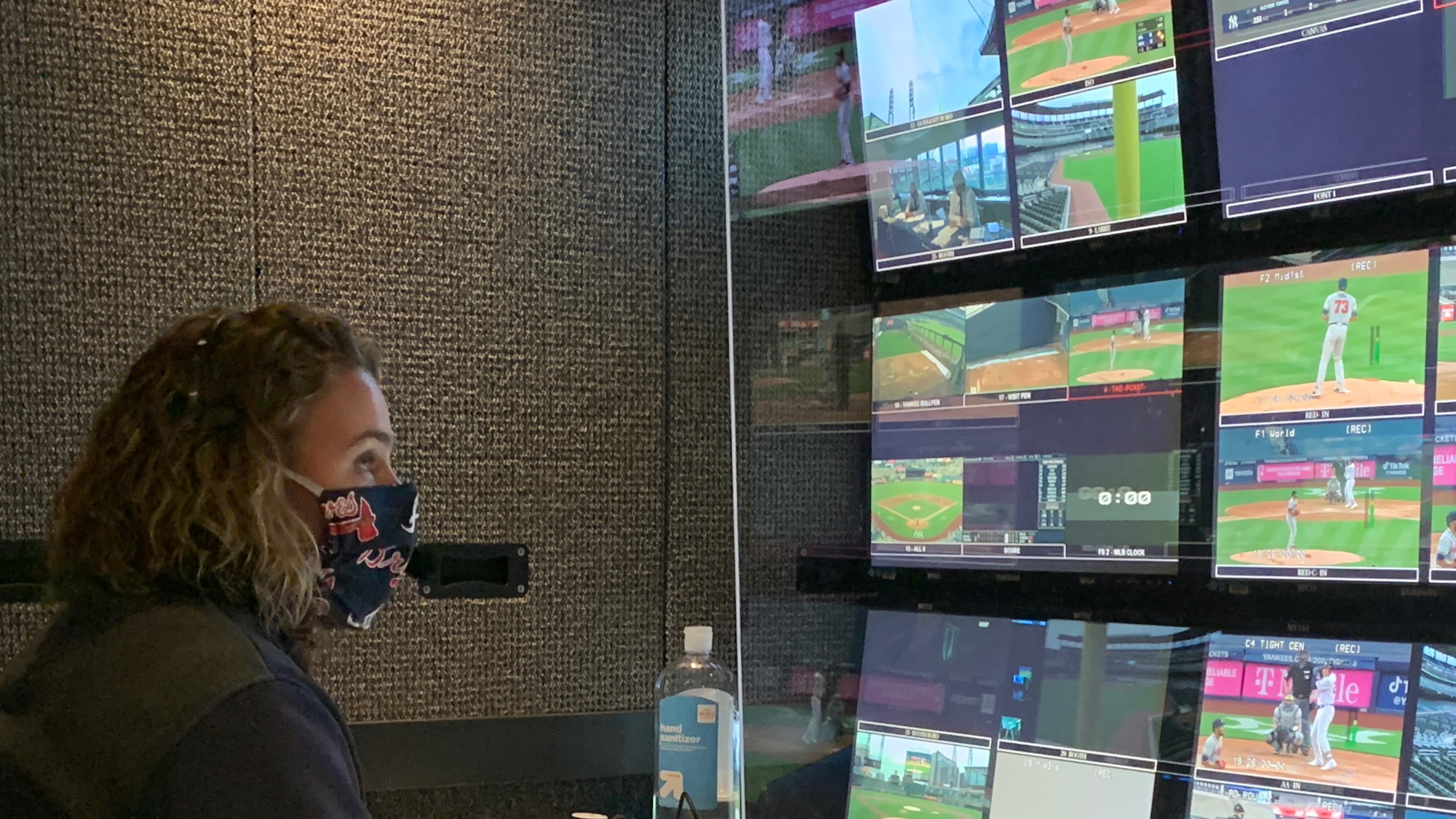 Gretchen Kaney, producer of Braves telecasts on Fox Sports South and Fox Sports Southeast, is at work in the production truck at a recent game.