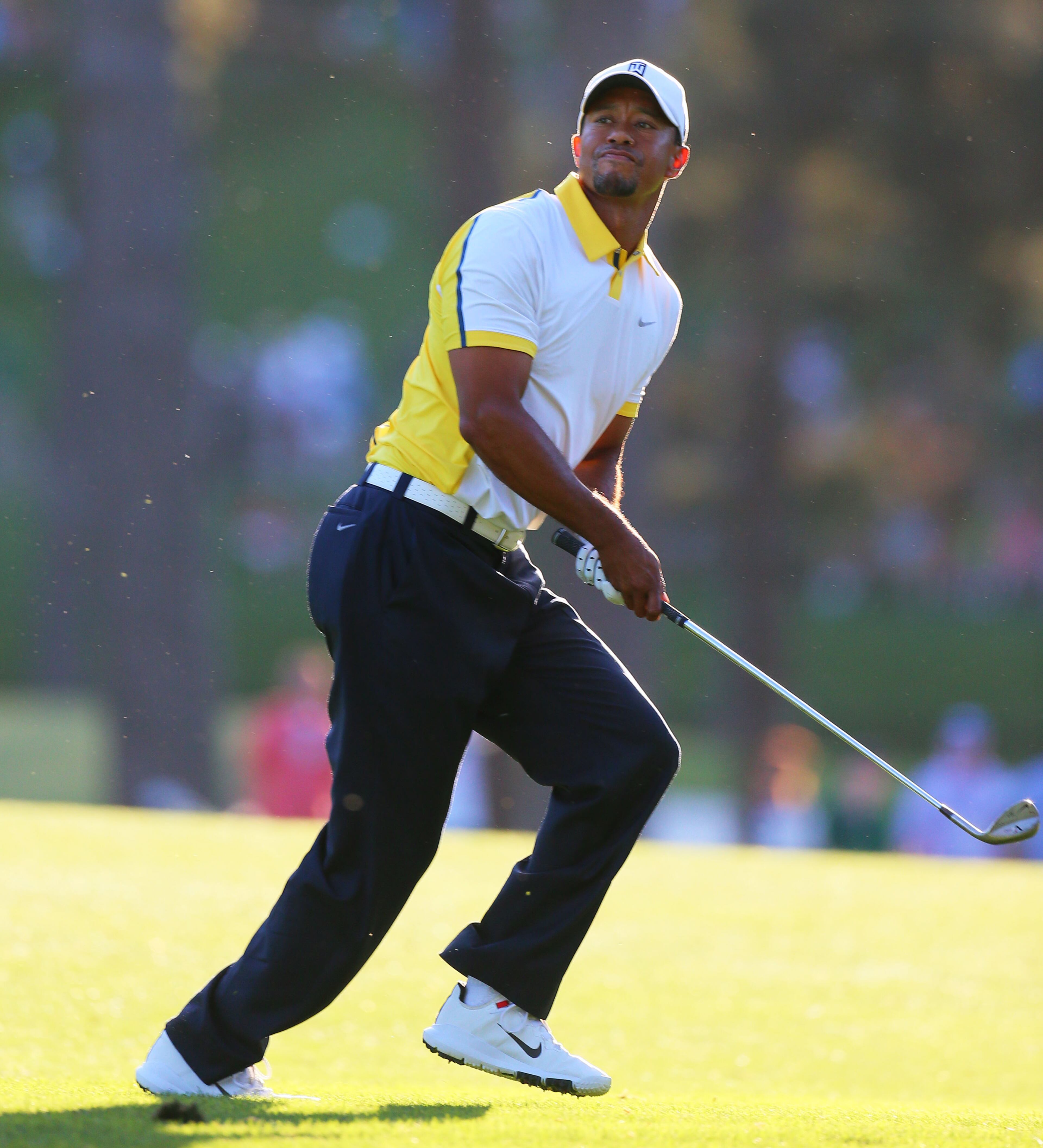 Tiger Woods reacts to his recovery shot from the fairway over the trees during the #17 green second round in the Masters Tournament at Augusta National Golf Club on Friday April 12 2013. CURTIS COMPTON / CCOMPTON@AJC.COM