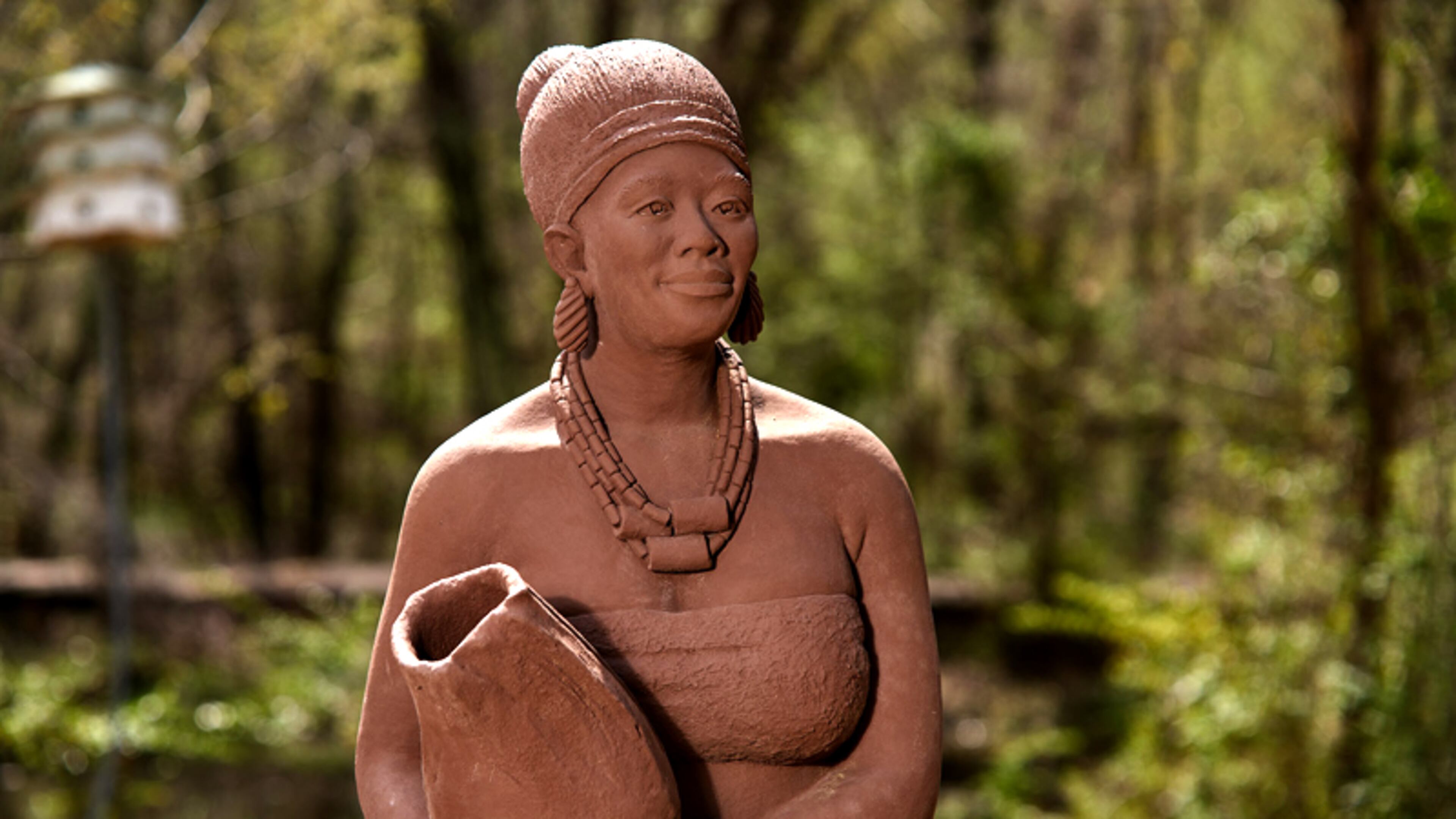 “Reception,” by Nigerian artist Fred Ajanogha, fulfills a Nigerian tradition that visitors should be welcomed by the most beautiful woman within the house and offered a gift. Reception is a stone cast sculpture of an African woman, dressed in traditional attire, holding a drinking gourd. ROSWELL ARTS FUND
