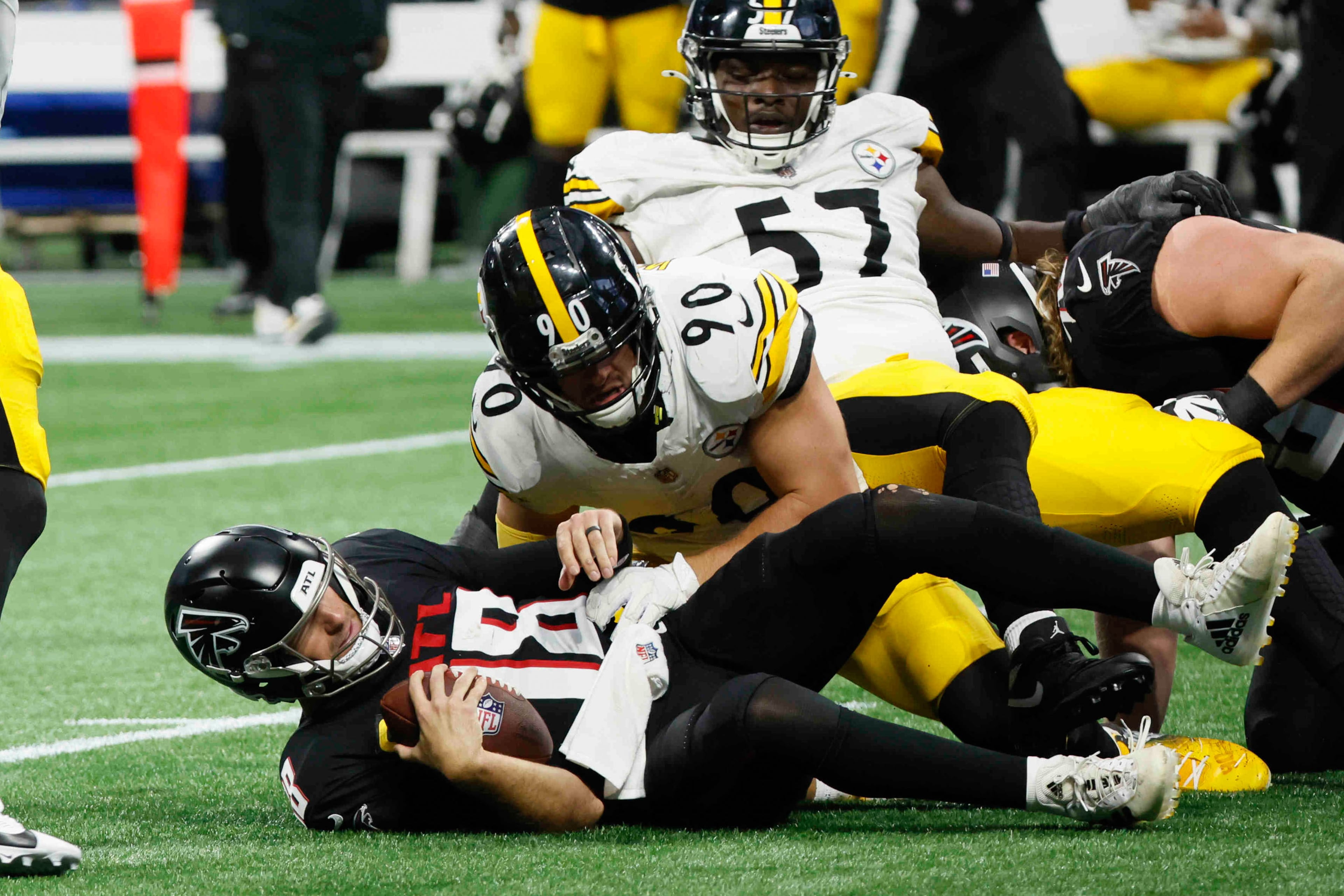 Atlanta Falcons quarterback Kirk Cousins (18) is sacked on the game’s last play by Pittsburgh Steelers linebacker T.J. Watt (90) on Sunday, Sept. 8, at Mercedes-Benz Stadium in Atlanta. The Falcons lost 18-10.
(Miguel Martinez/ AJC)