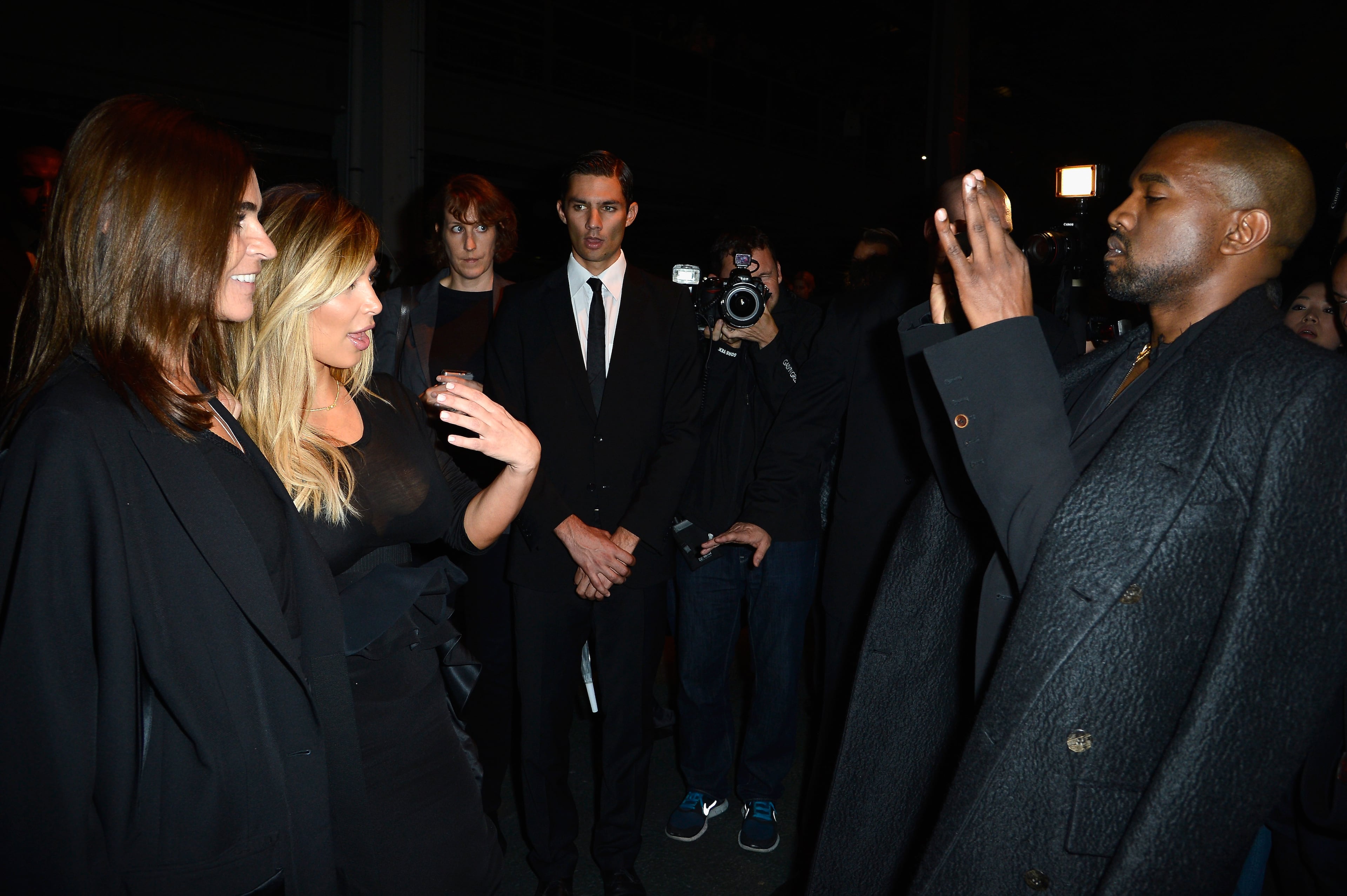 PARIS, FRANCE - SEPTEMBER 29: Carine Roitfeld and Kim Kardashian pose for Kanye West as they attend the Givenchy show as part of the Paris Fashion Week Womenswear Spring/Summer 2014 on September 29, 2013 in Paris, France. (Photo by Pascal Le Segretain/Getty Images)