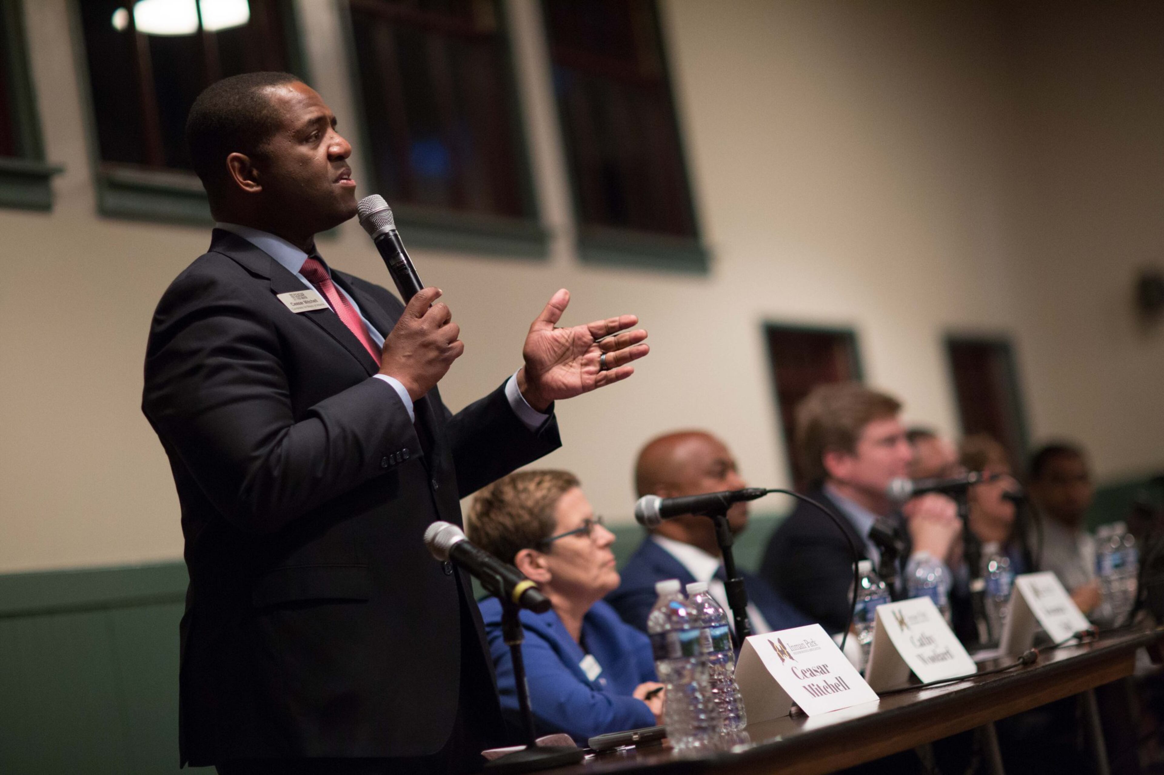 City Council President Ceasar Mitchell (left) talks during an Inman Park mayoral candidate forum in The Trolley Barn, Wednesday, Oct. 4, 2017, in Atlanta. BRANDEN CAMP / SPECIAL