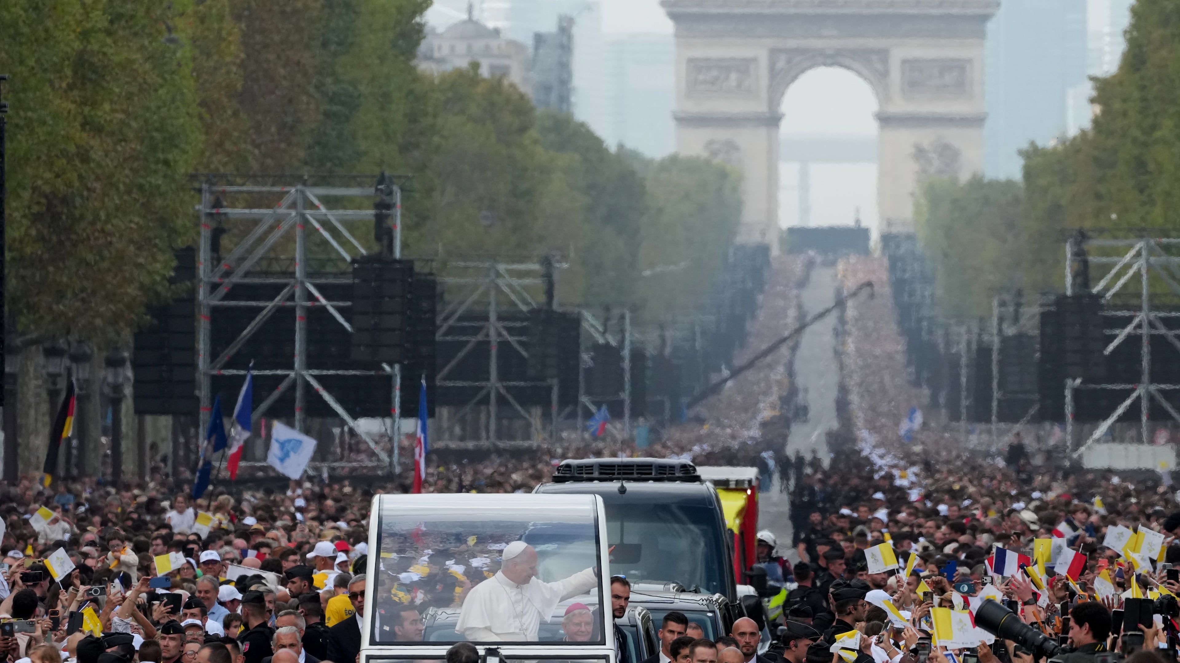 Pope Leo XIV greets faithful as he arrives to celebrate mass at Place de la Concorde, Paris, Saturday, Sept. 26, 2026. (AP Photo/Gregorio Borgia)