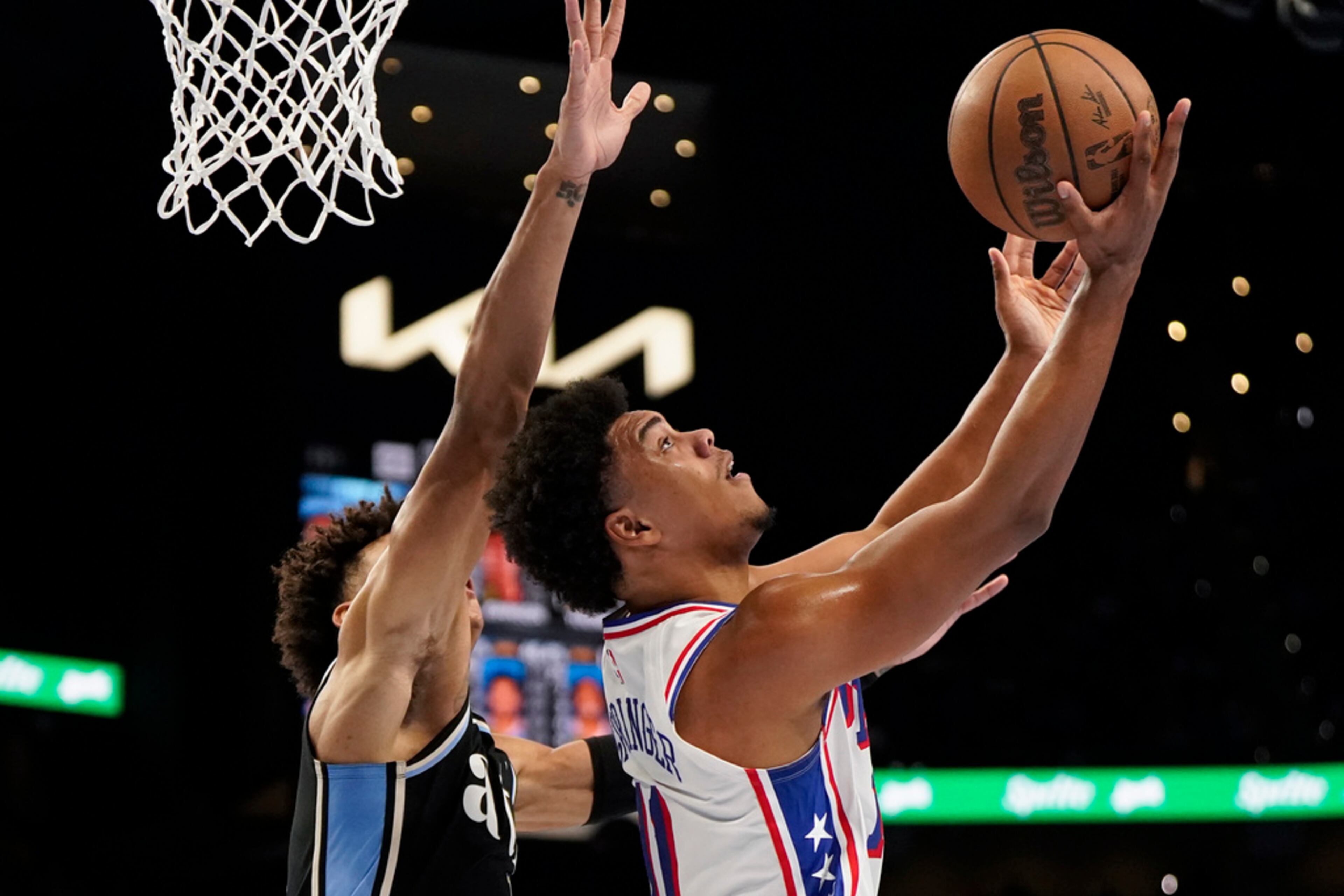 Philadelphia 76ers guard Jaden Springer (11) shoots ahainst Atlanta Hawks forward Jalen Johnson (1) during the second half of an In-Season Tournament NBA basketball game, Friday, Nov. 17, 2023, in Atlanta. (AP Photo/Mike Stewart)