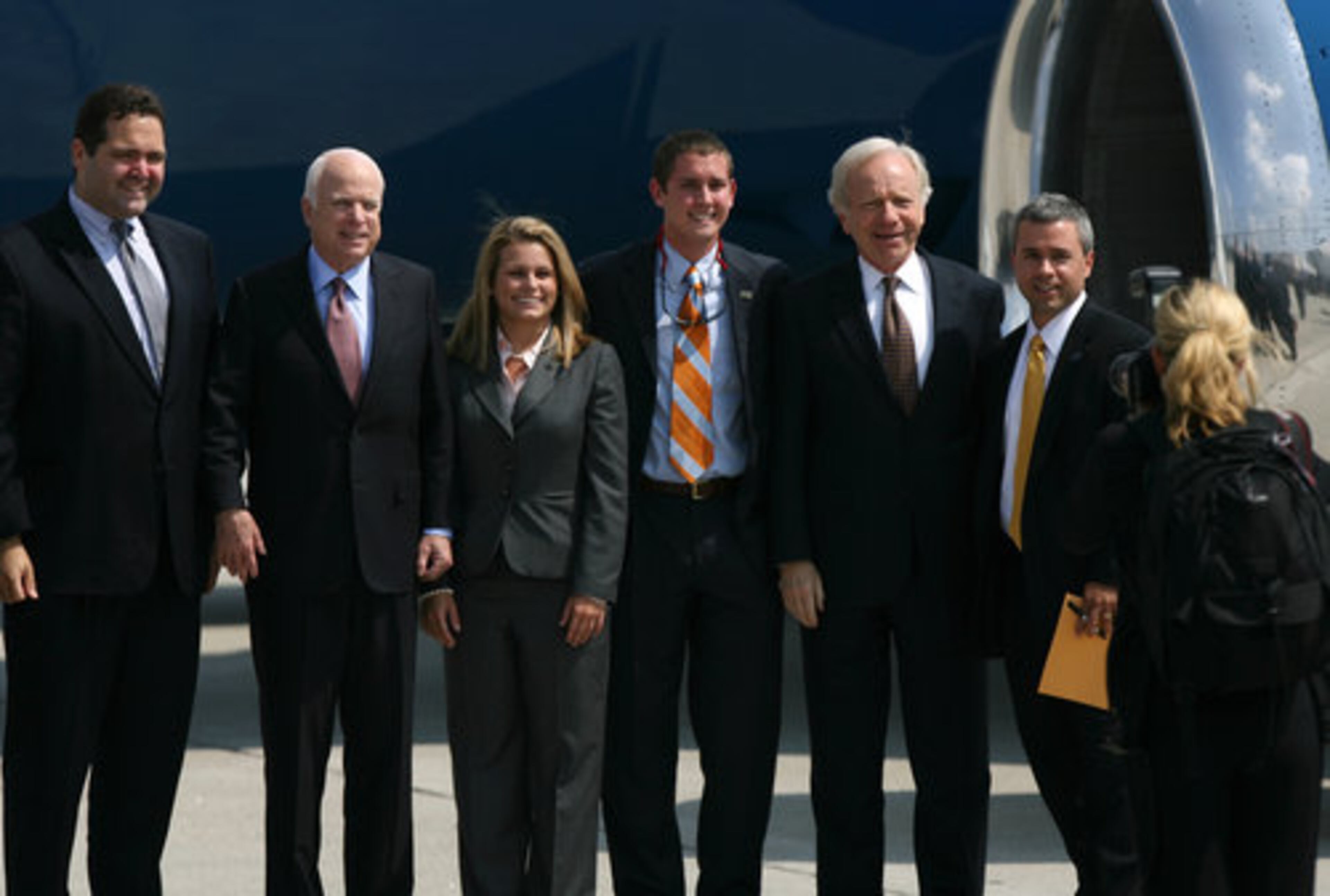 (From left to right) Supporter Louis Oliverio poses for a photo with Sen. John McCain alongside Jade Morey, David Bachman, Sen. Joe Lieberman (D-Connecticut) and Shawn Davis as McCain arrives at Atlantic Aviation in Atlanta.