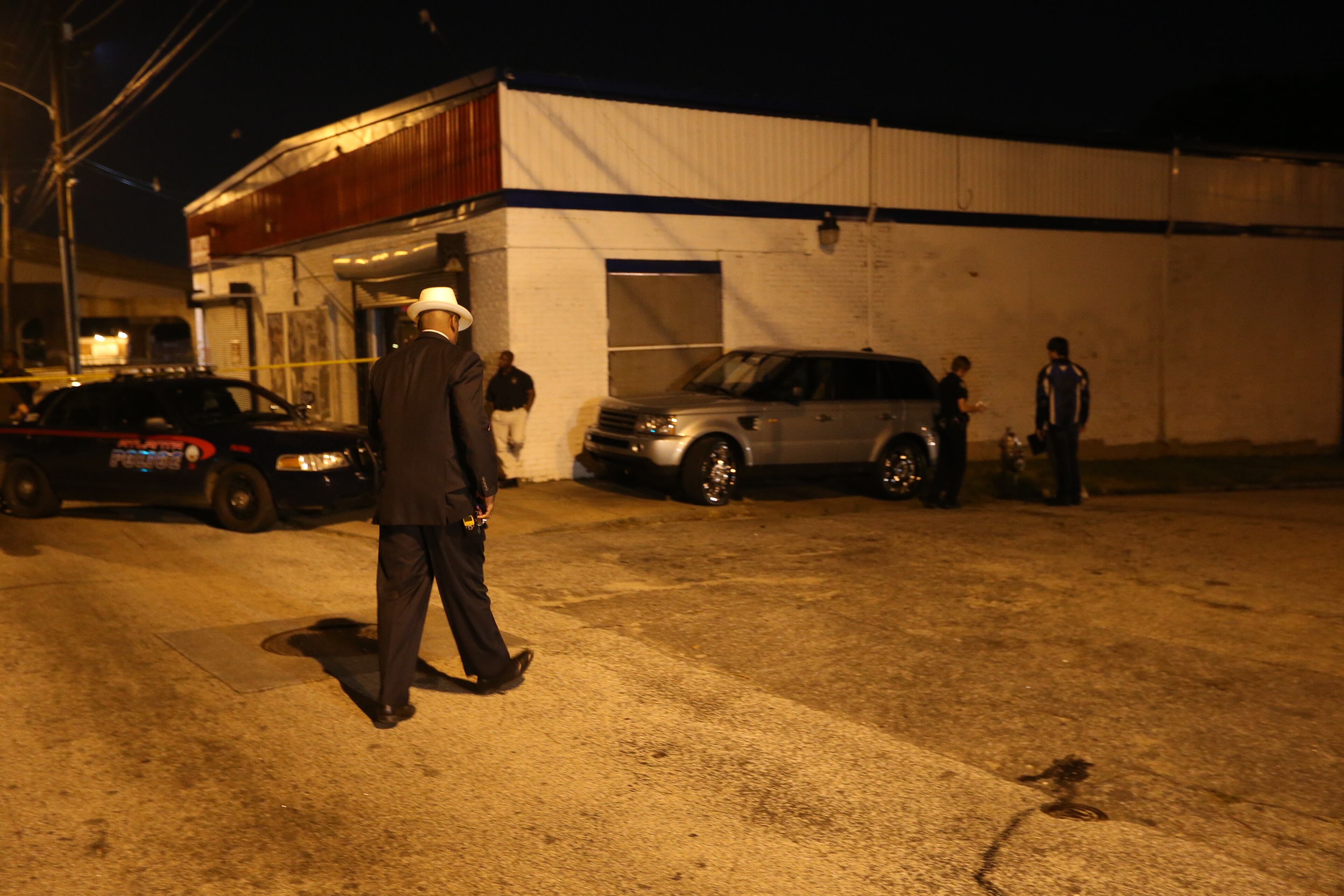 Atlanta police investigate a triple shooting on Lee Street that left one person dead Tuesday, May 20, 2014.