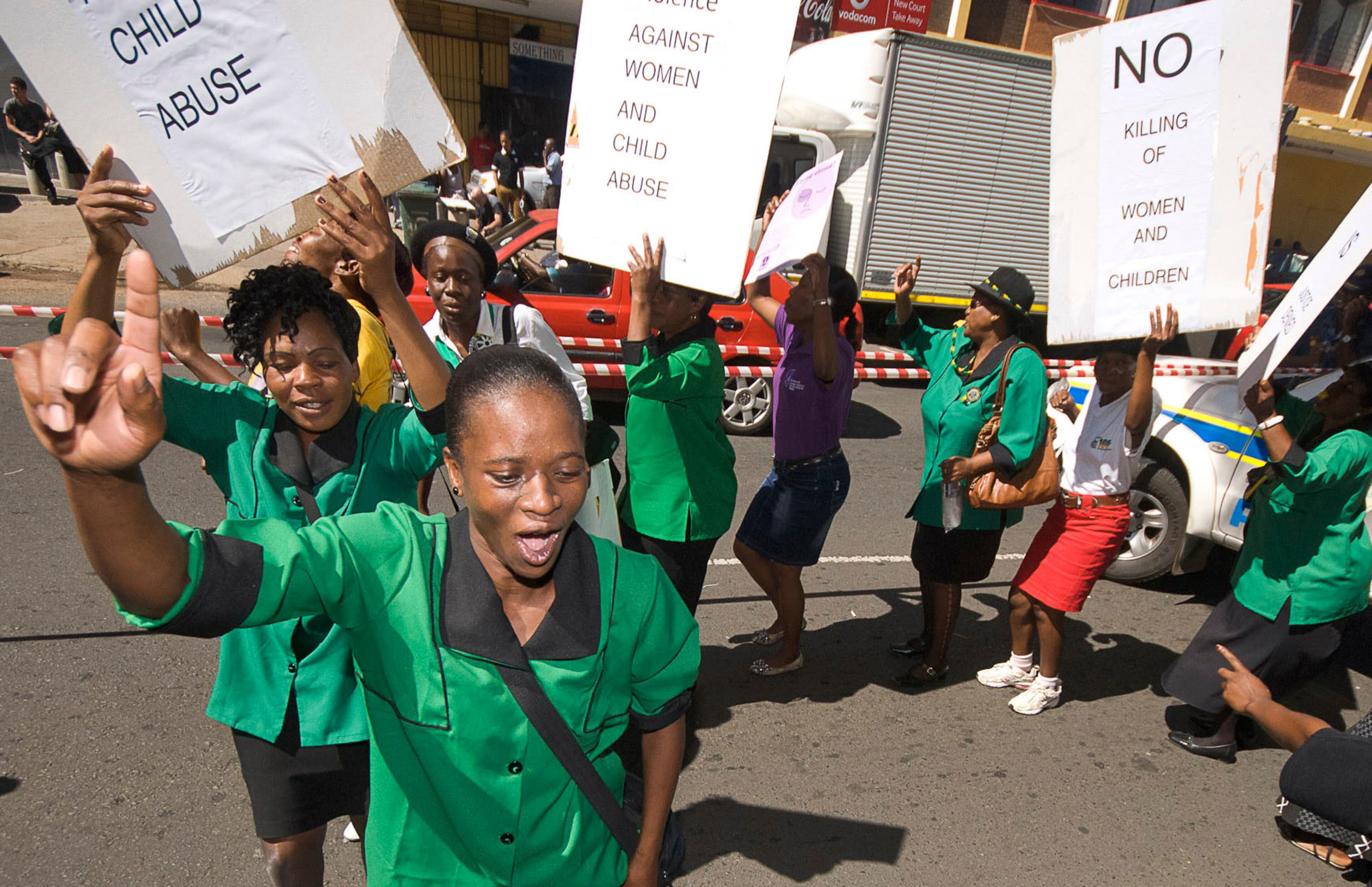 A women's group protest, outside the court in Pretroia, South Africa, Tuesdayy, Feb 19, 2013 where Olympian athlete Oscar Pistorius was attending his bail hearing. A South African prosecutor said that Pistorius fired into the door of a small bathroom where his girlfriend, Reeva Steenkamp, was cowering after a shouting match on Valentine's Day, hitting her three times, and has charged the sports icon with premeditated murder. The magistrate ruled that Pistorius faces the harshest bail requirements available in South African law. He did not elaborate before a break was called in the session. (AP Photo/Waldo Swiegers)