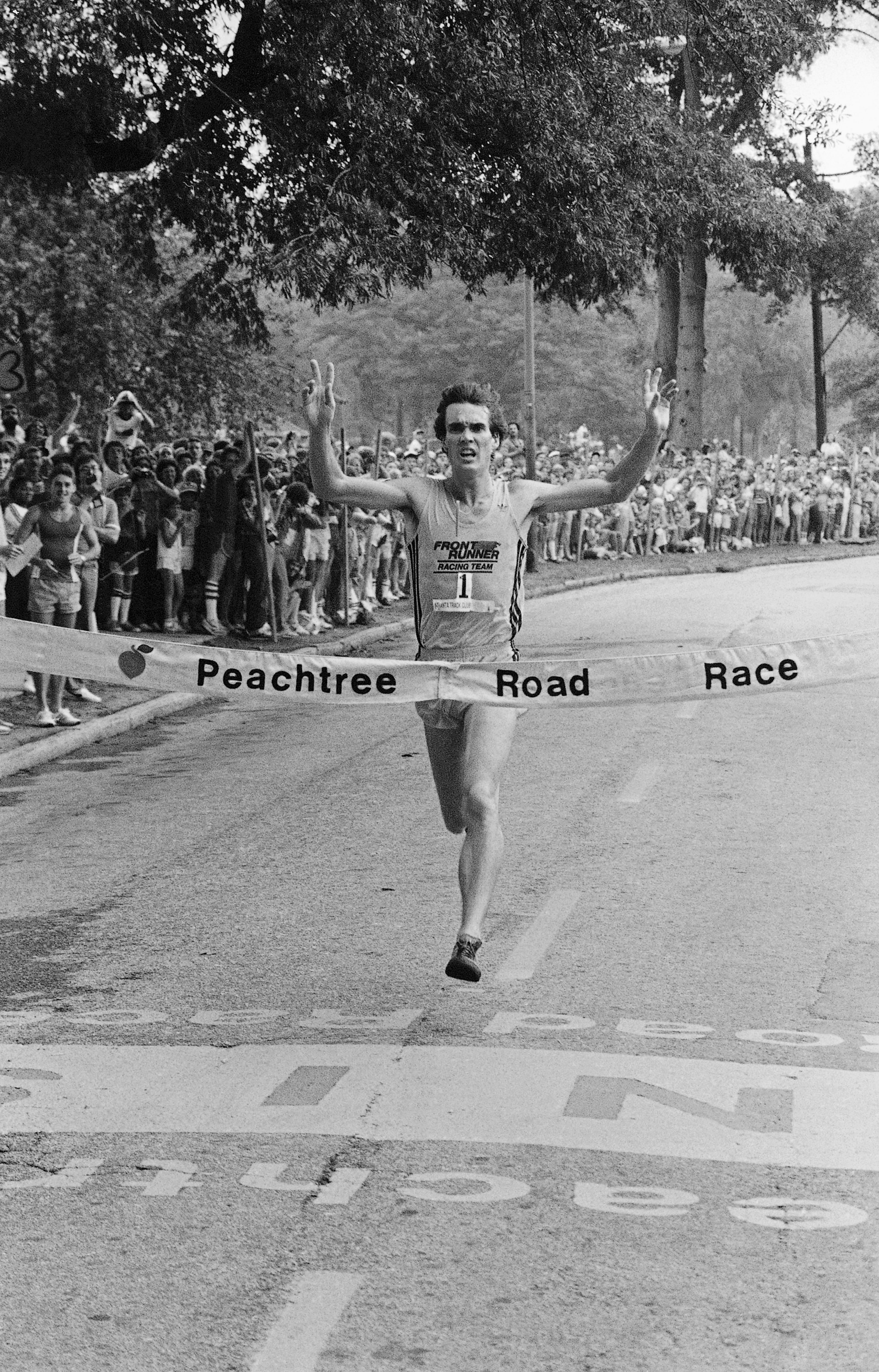 1981: Craig Virgin raises his arms in victory as he approaches the finish line in the 6.2-mile Peachtree Road Race run in Atlanta on Saturday, July 6, 1981. Virgin won the race for the third year in a row with a record time of 28:03. (AP Photo/Gary Gardiner)