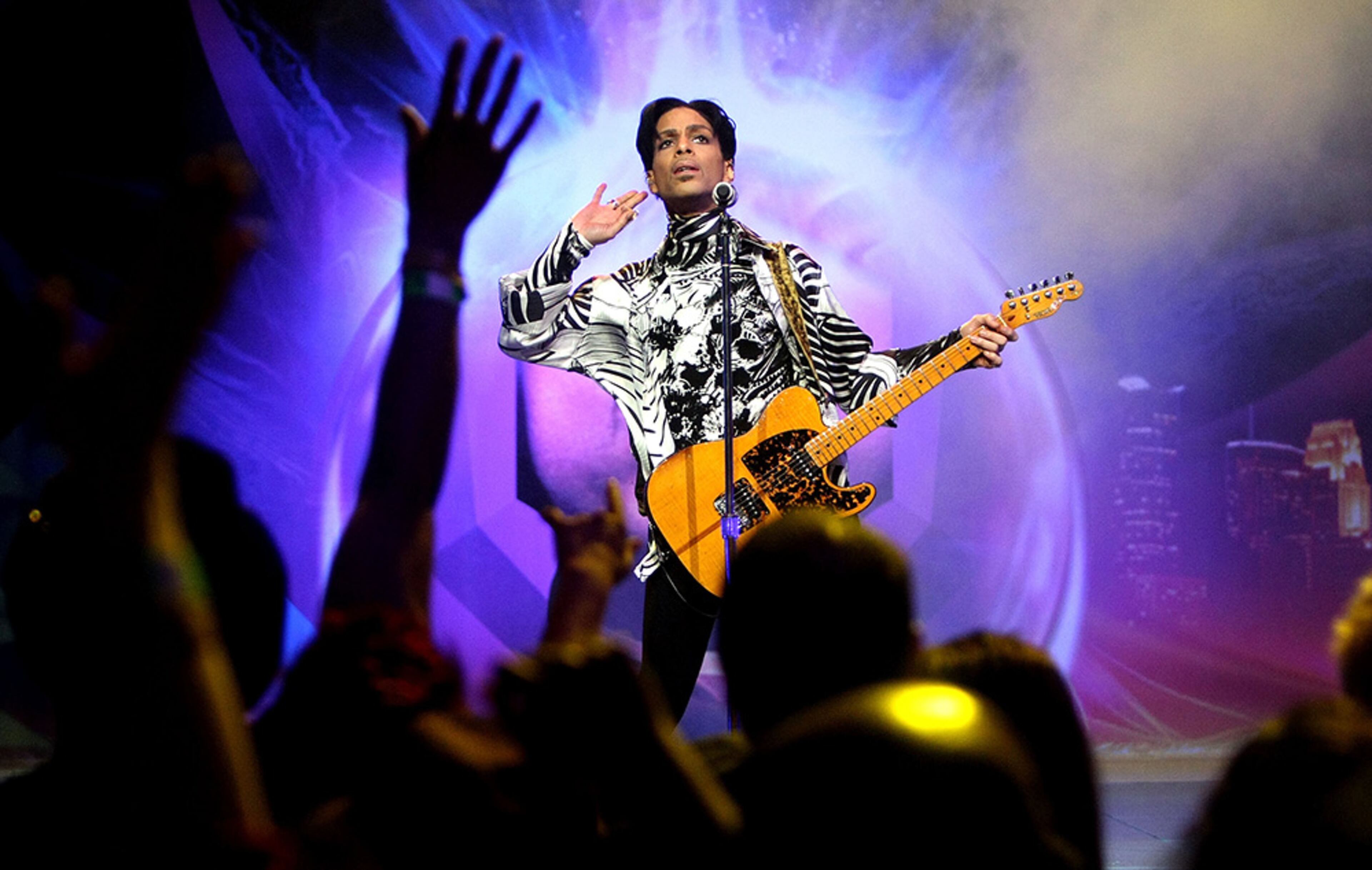 Prince performs his first of three shows onstage during "One Night... Three Venues" hosted by Prince and Lotusflow3r.com held at NOKIA Theatre L.A. LIVE on March 28, 2009 in Los Angeles.