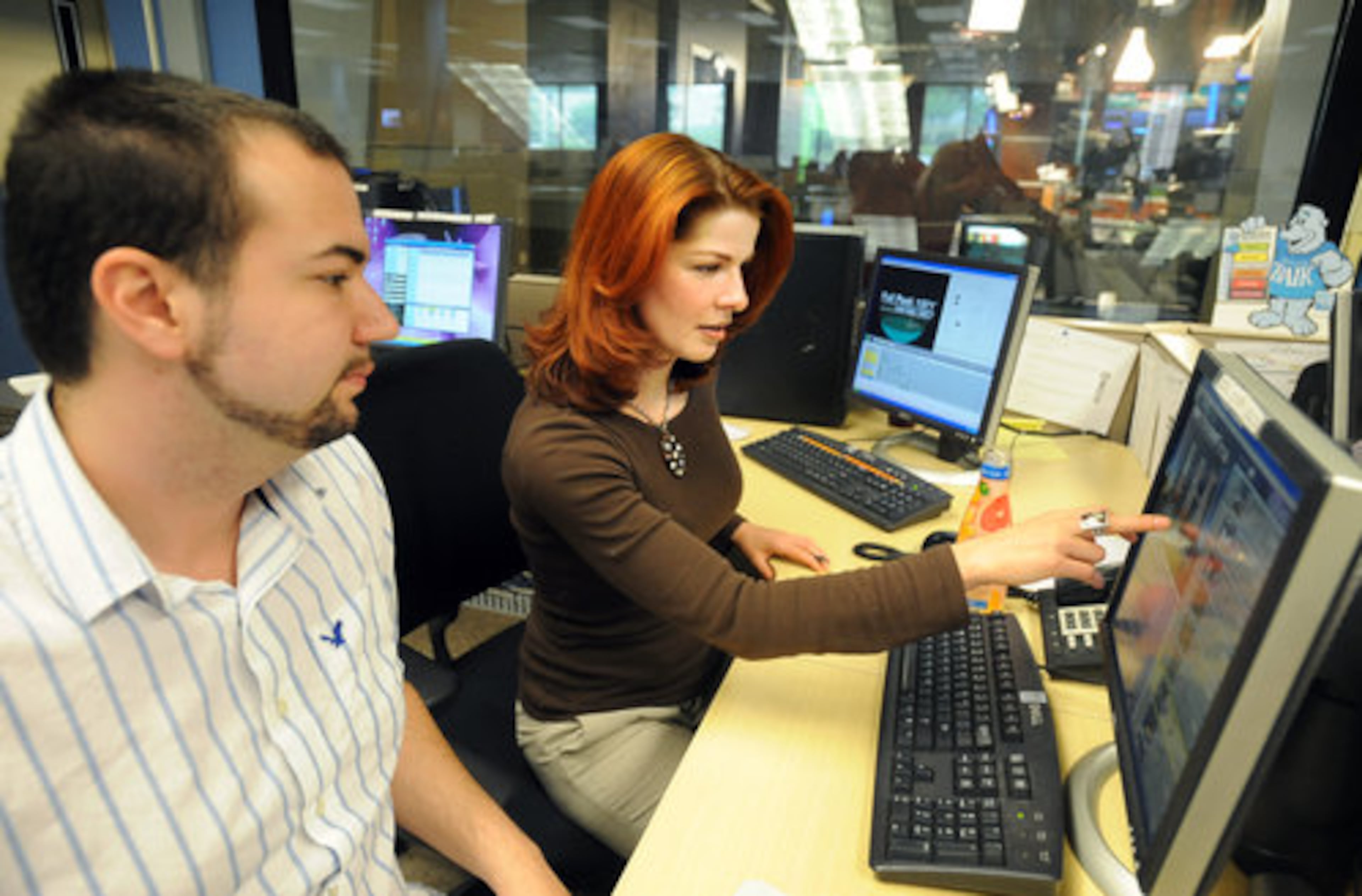 Weather producer Jason Disharoon helps Dagmar Midcap prepare for the broadcast. If you wonder about her appeal, fan Mike Beavers sums it up best: "She comes across as the perfect woman -- a perfect 10 who can hang with the guys."