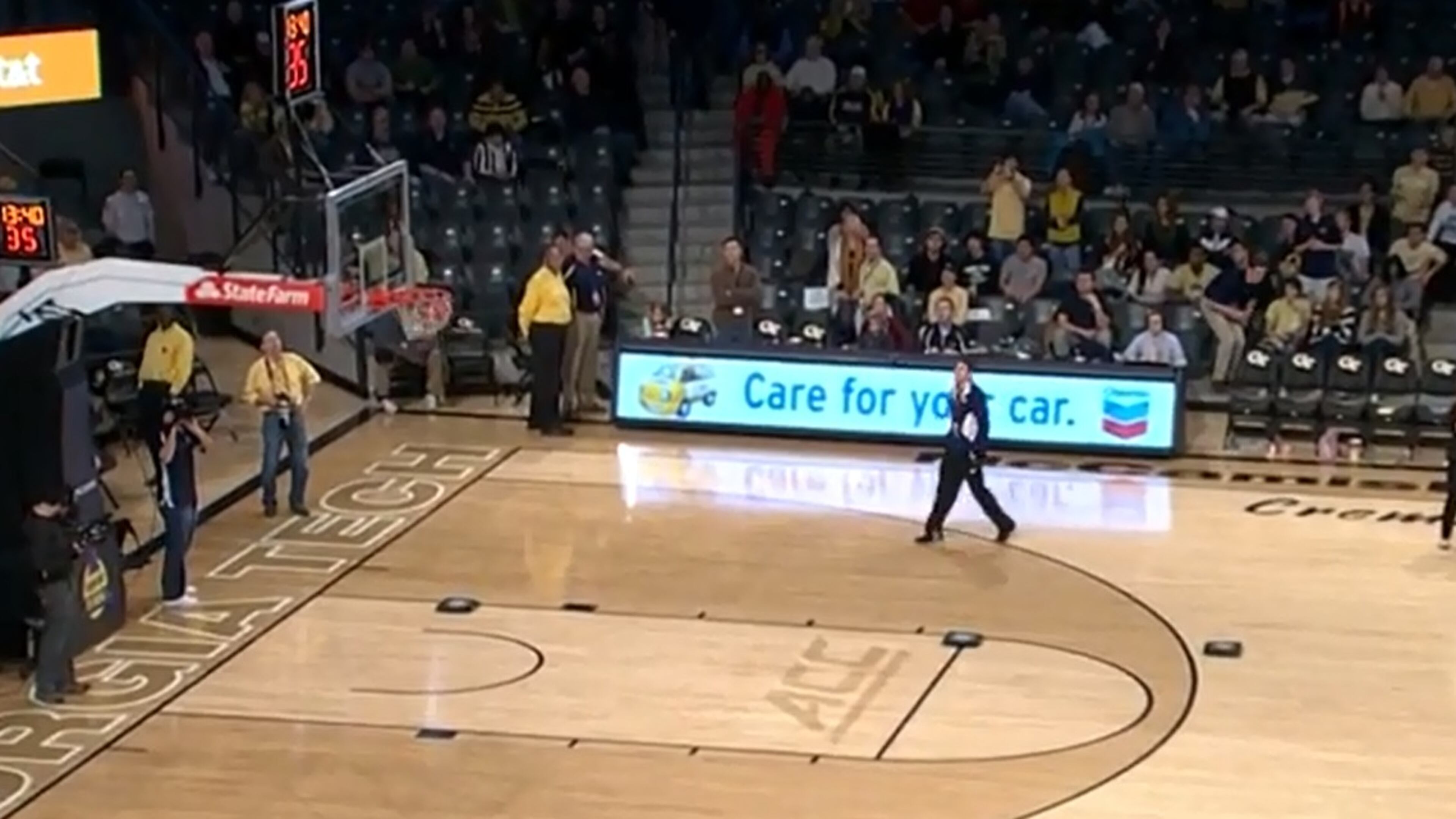 Georgia Tech student Caleb Espy admires his handiwork - a made halfcourt shot that won him 30 free pizzas.
