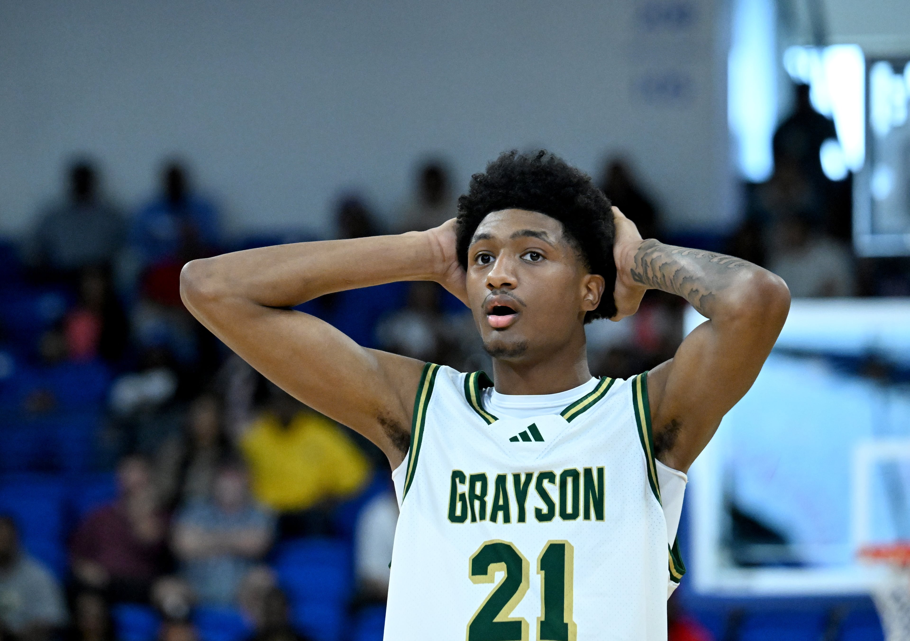 Grayson's Jacob Wilkins (21) reacts during the second half of the GHSA Class 6A Boys State Basketball playoffs game at the Georgia State Convocation Center, Saturday, March 1, 2025, in Atlanta. Wheeler won 68-53 over Grayson. (Hyosub Shin / AJC)