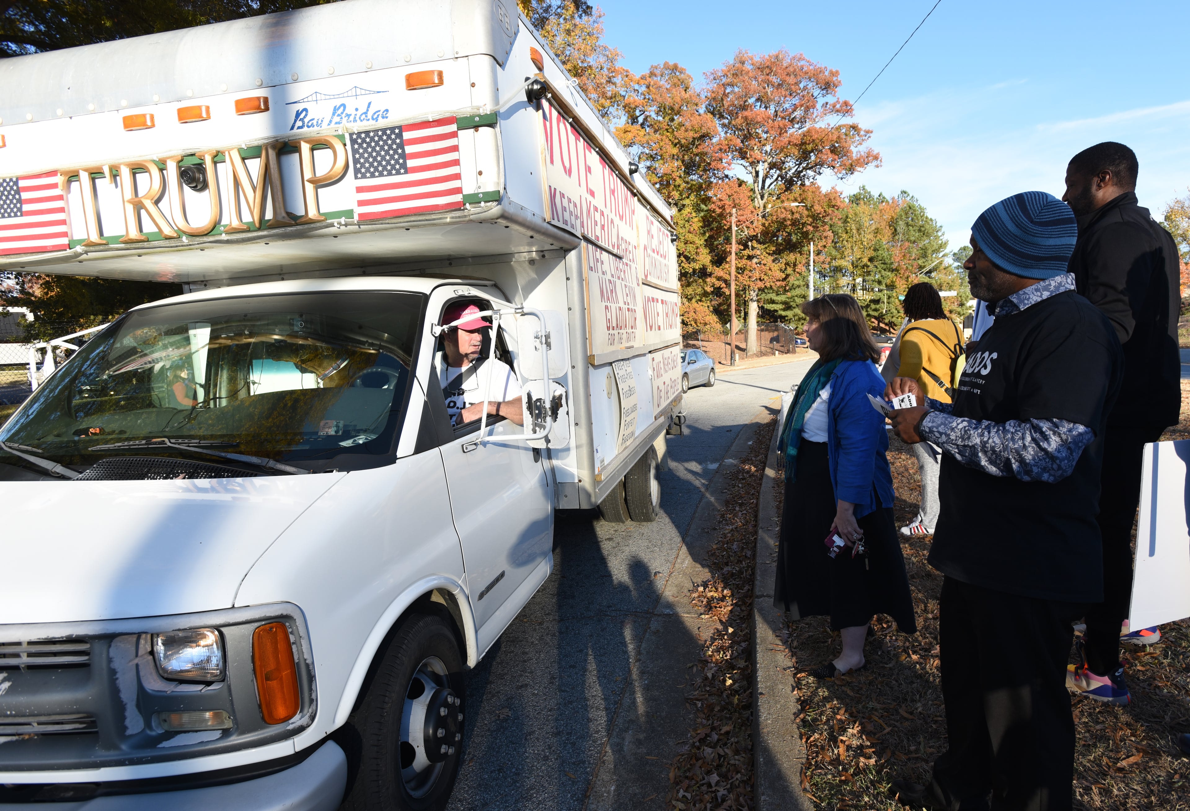 November 20, 2019 Atlanta - A supporter of President Donald Trump (left) argues with a group of Democratic presidential candidate supporters outside Tyler Perry Studios ahead of the 2020 Democratic presidential debate on Tuesday, November 20, 2019. (Hyosub Shin / Hyosub.Shin@ajc.com)