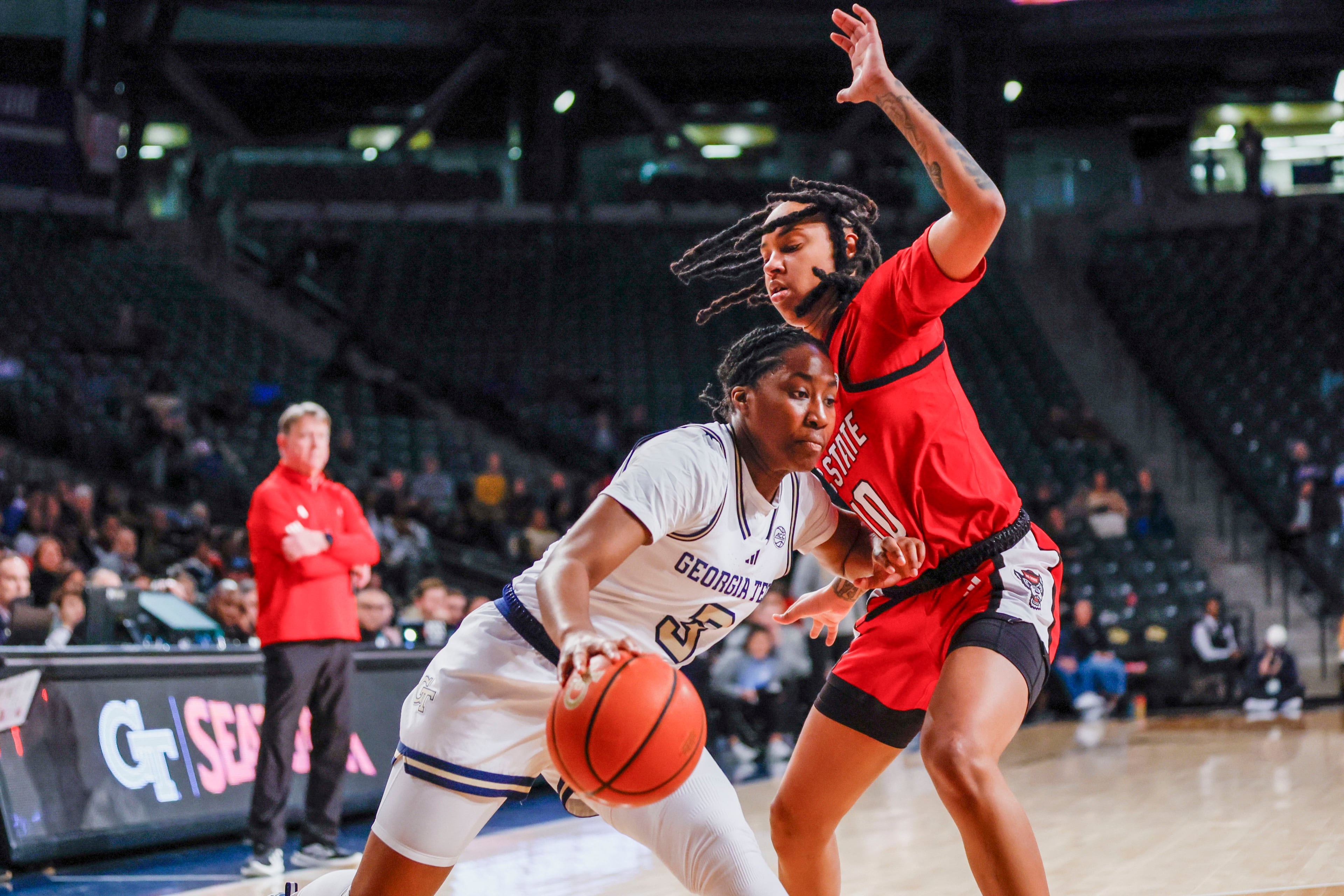 Georgia Tech Yellow Jackets guard Dani Carnegie (3) dribbles against NC State Wolfpack guard Aziaha James (10) during the second half.
(Miguel Martinez/ AJC)
