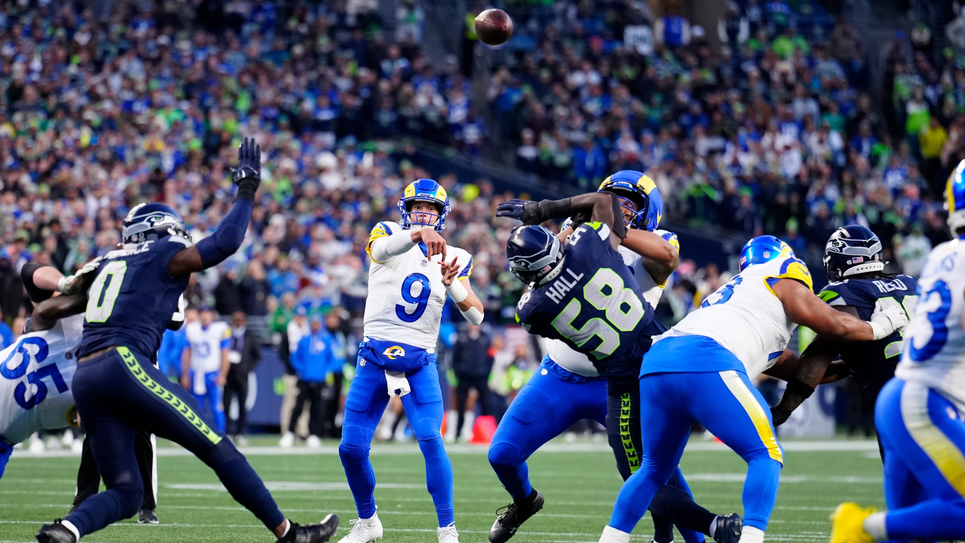 FILE - Los Angeles Rams quarterback Matthew Stafford (9) passes the ball during the NFC Championship NFL football game, Jan. 25, 2026, in Seattle. (AP Photo/Ben VanHouten, File)