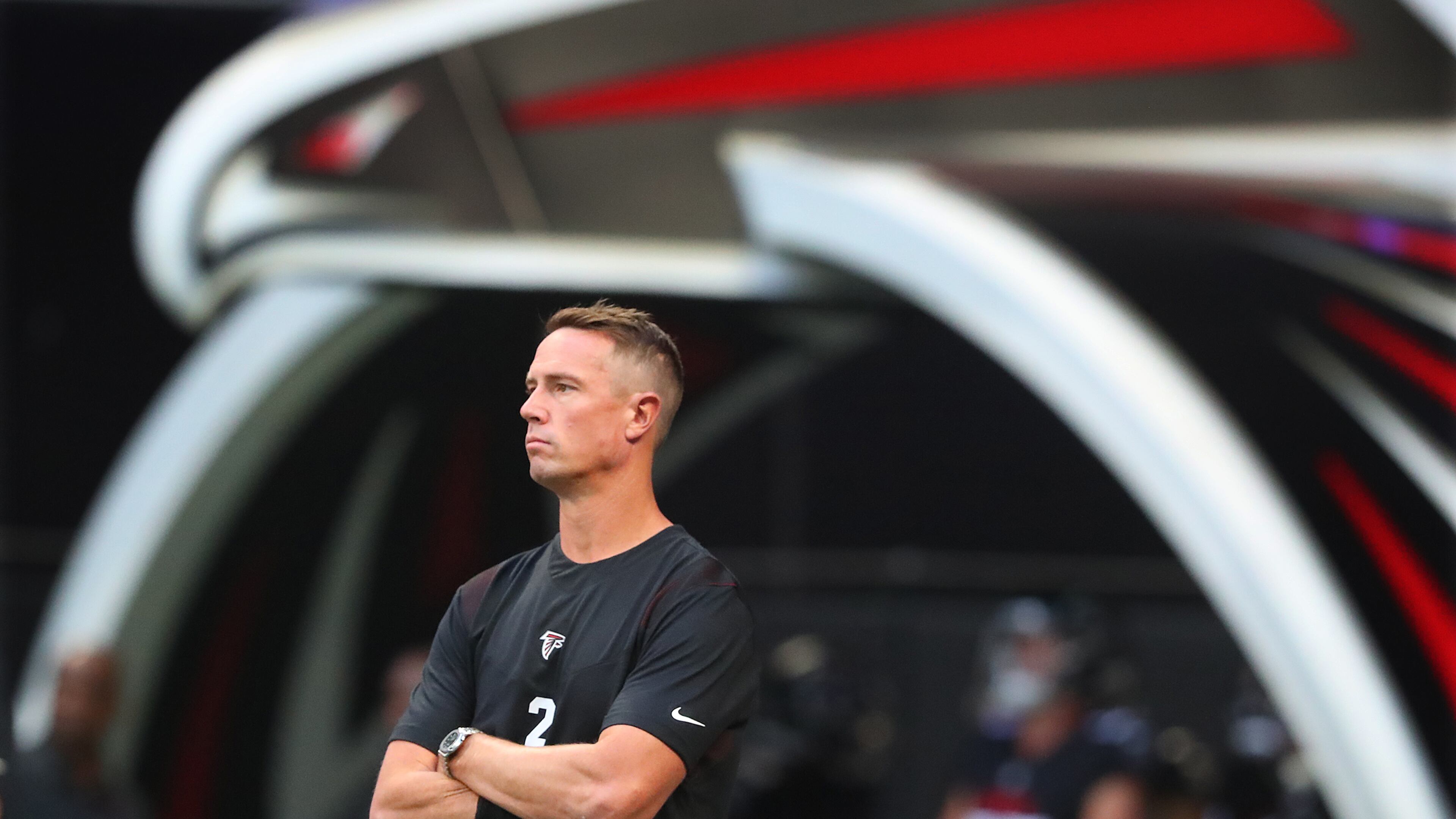 081321 Atlanta: Atlanta Falcons quarterback Matt Ryan, apparently not playing against the Tennessee Titans, watches teammates warmup for a NFL preseason football game on Friday, August 13, 2021, in Atlanta. “Curtis Compton / Curtis.Compton@ajc.com”