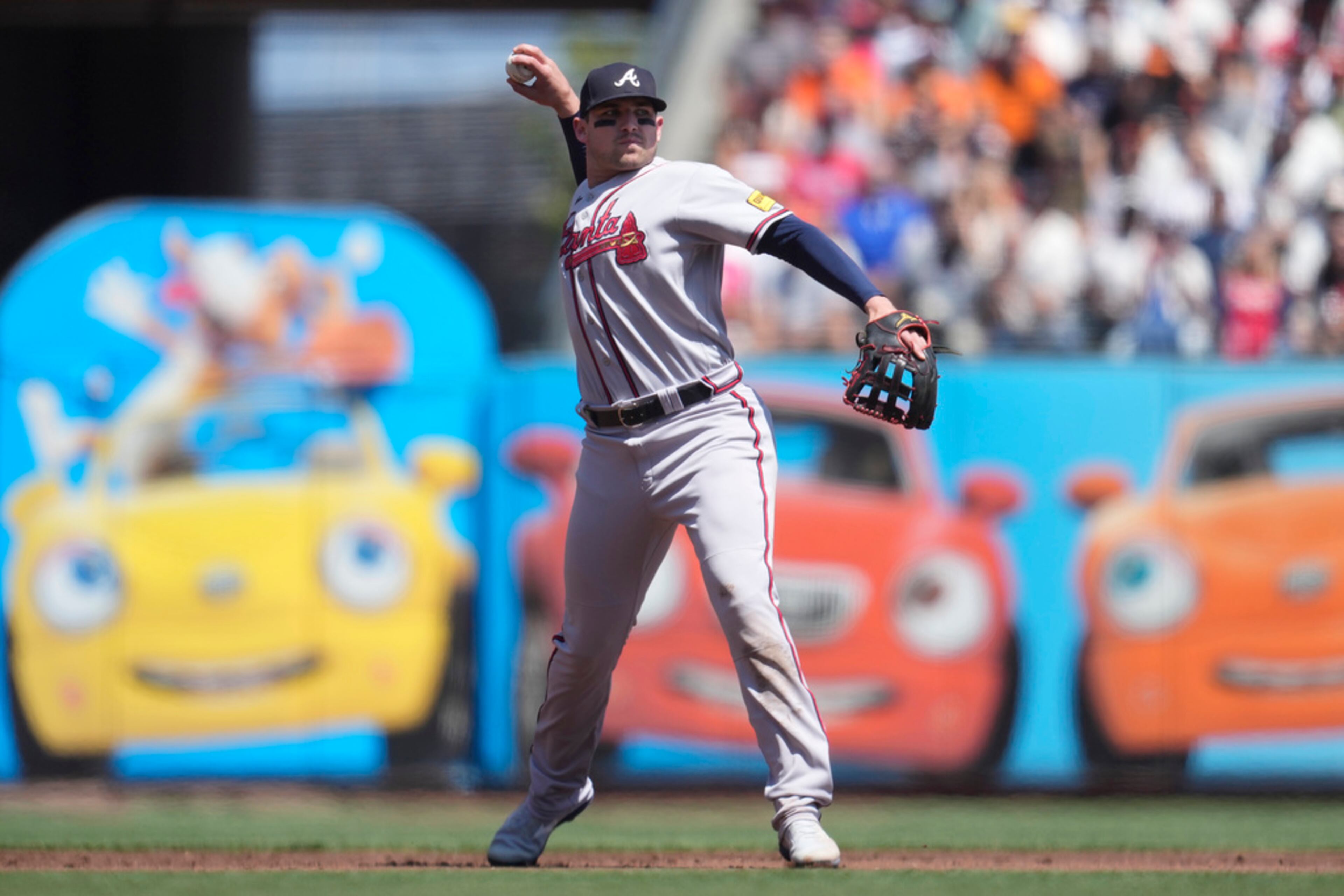 Atlanta Braves third baseman Austin Riley throws out San Francisco Giants' Wilmer Flores at first base during the first inning of a baseball game in San Francisco, Saturday, Aug. 26, 2023. (AP Photo/Jeff Chiu)