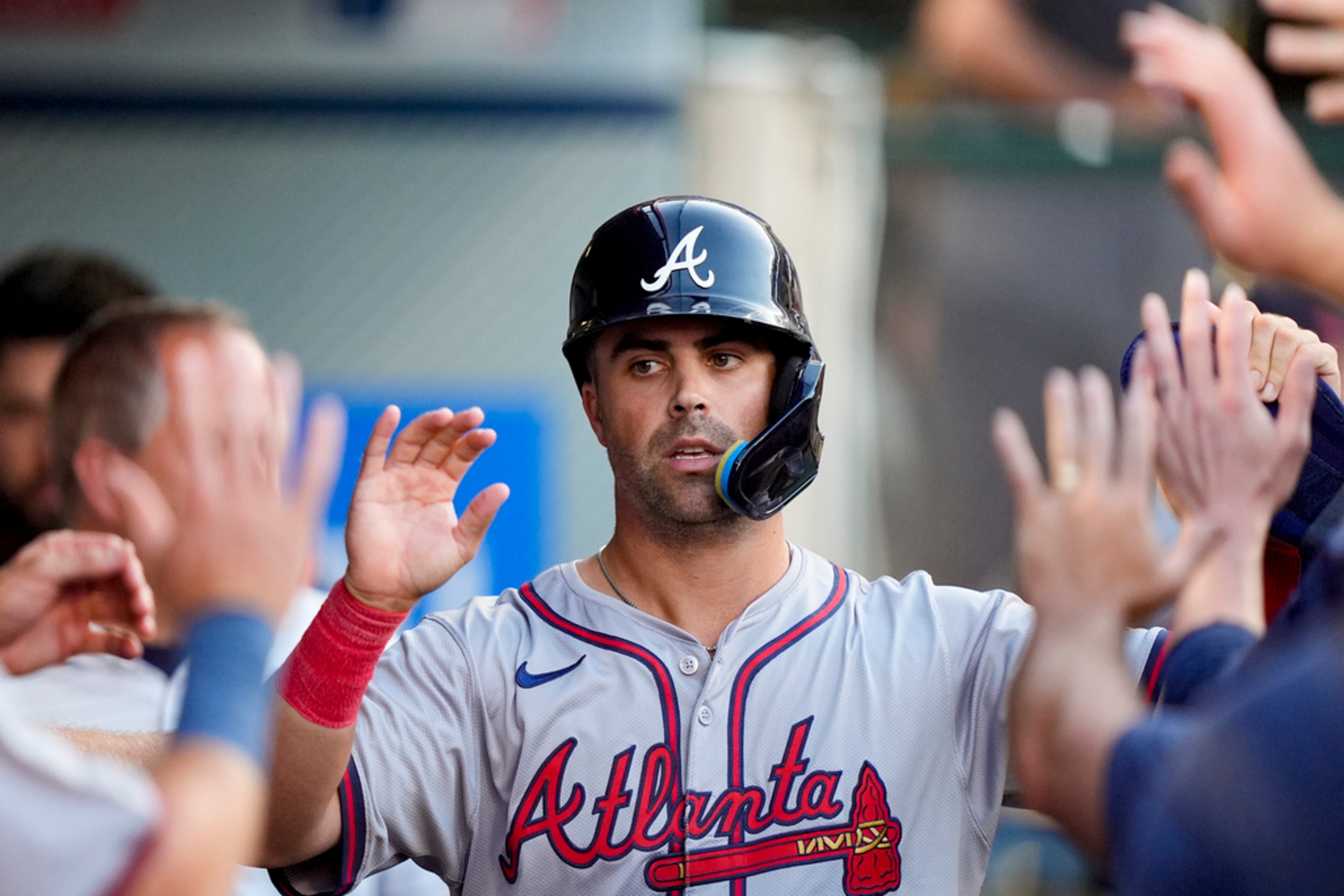 Atlanta Braves' Whitt Merrifield celebrates after scoring off a single hit by Michael Harris II during the second inning of a baseball game against the Los Angeles Angels, Saturday, Aug. 17, 2024, in Anaheim, Calif. (AP Photo/Ryan Sun)