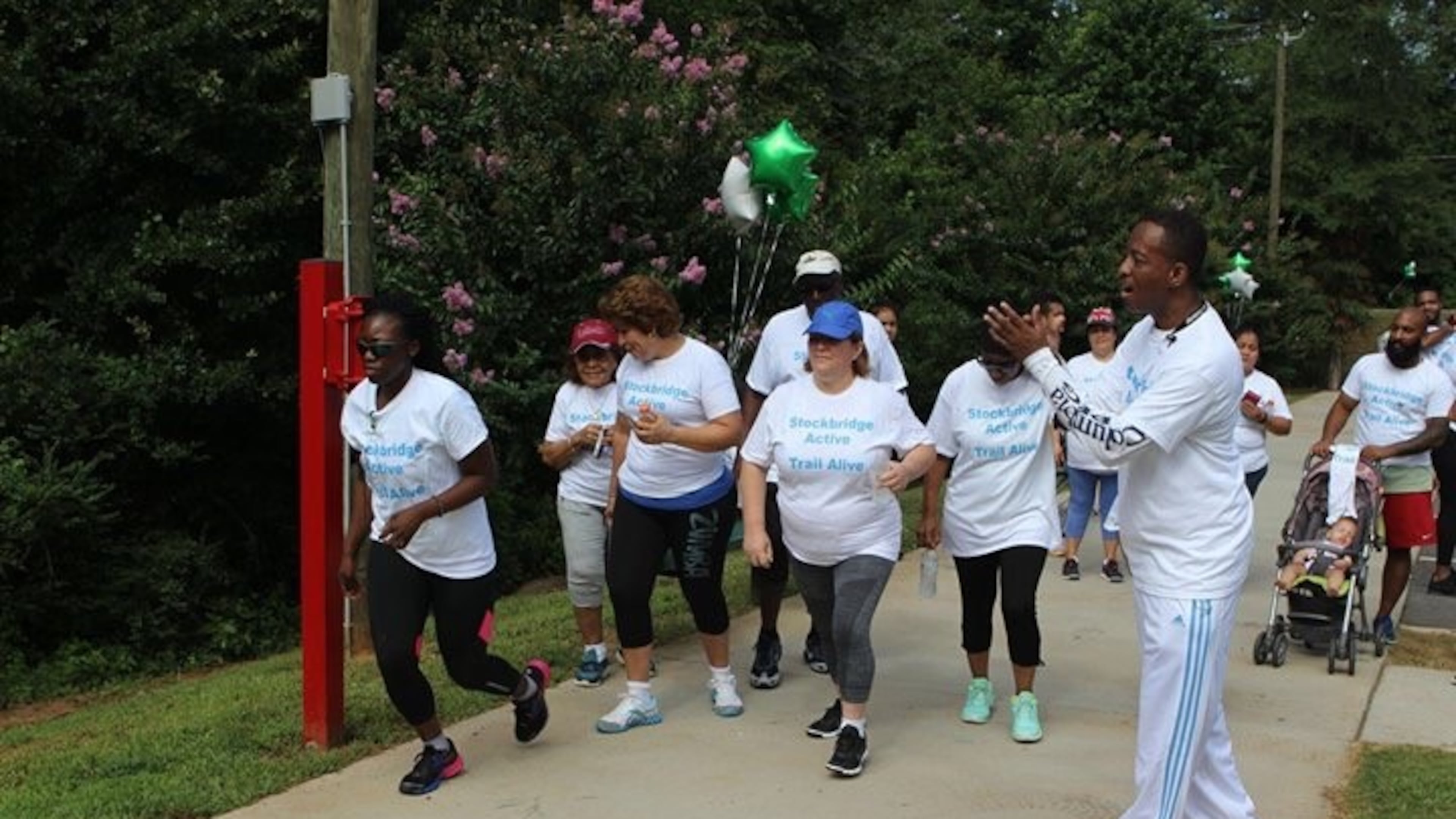 Stockbridge City Councilman Elton Alexander cheers on participants at "Trails Alive."