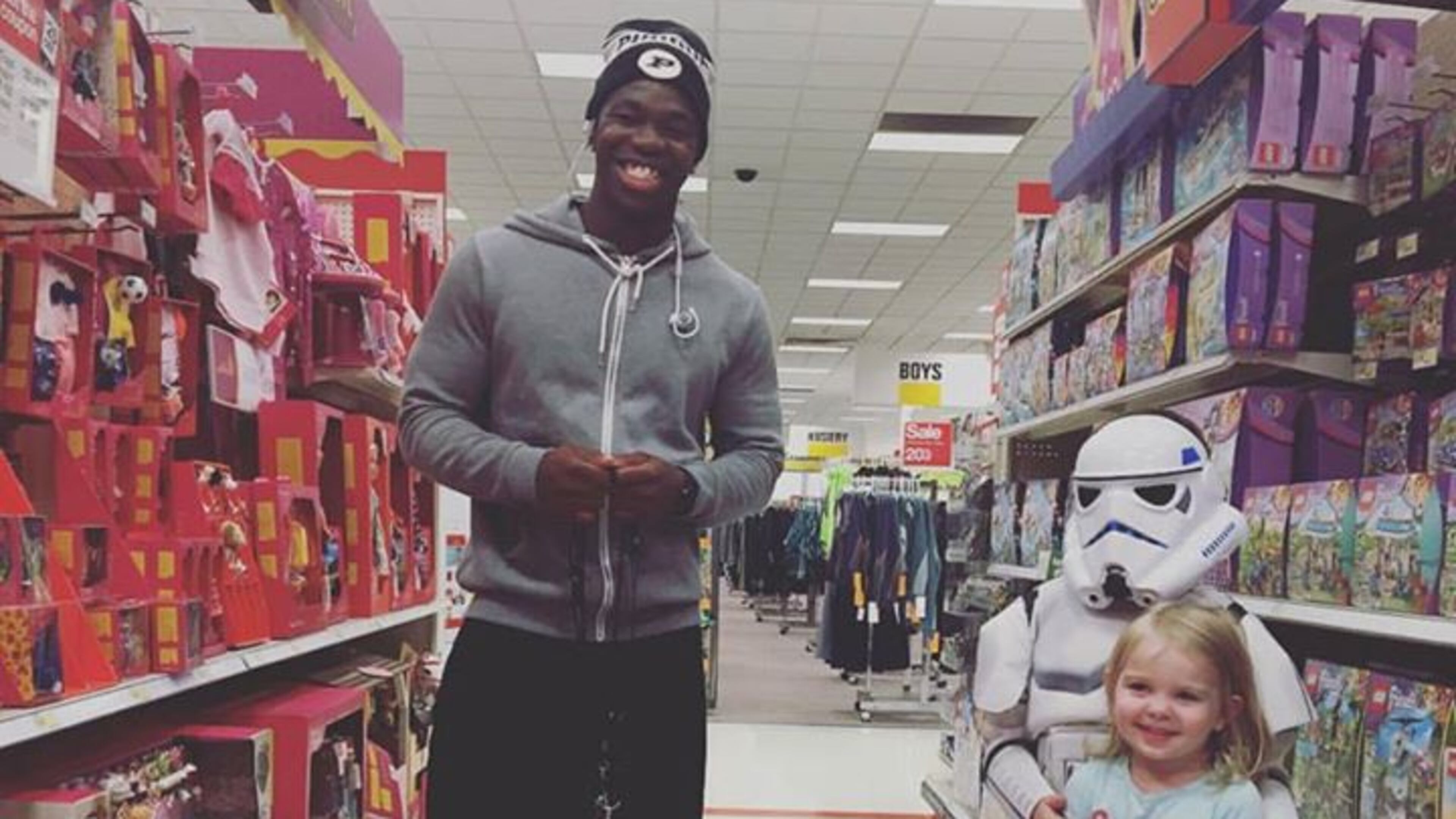 Tario Fuller, a football player at Purdue University and Gwinnett native, with a doll he bought for two-year-old Kinley for her birthday at a Target in Indiana. Photo by Megan Shufflebarger. Tario Fuller, a football player at Purdue University and Gwinnett native, with a doll he bought for two-year-old Kinley for her birthday at a Target in Indiana. Photo by Megan Shufflebarger.