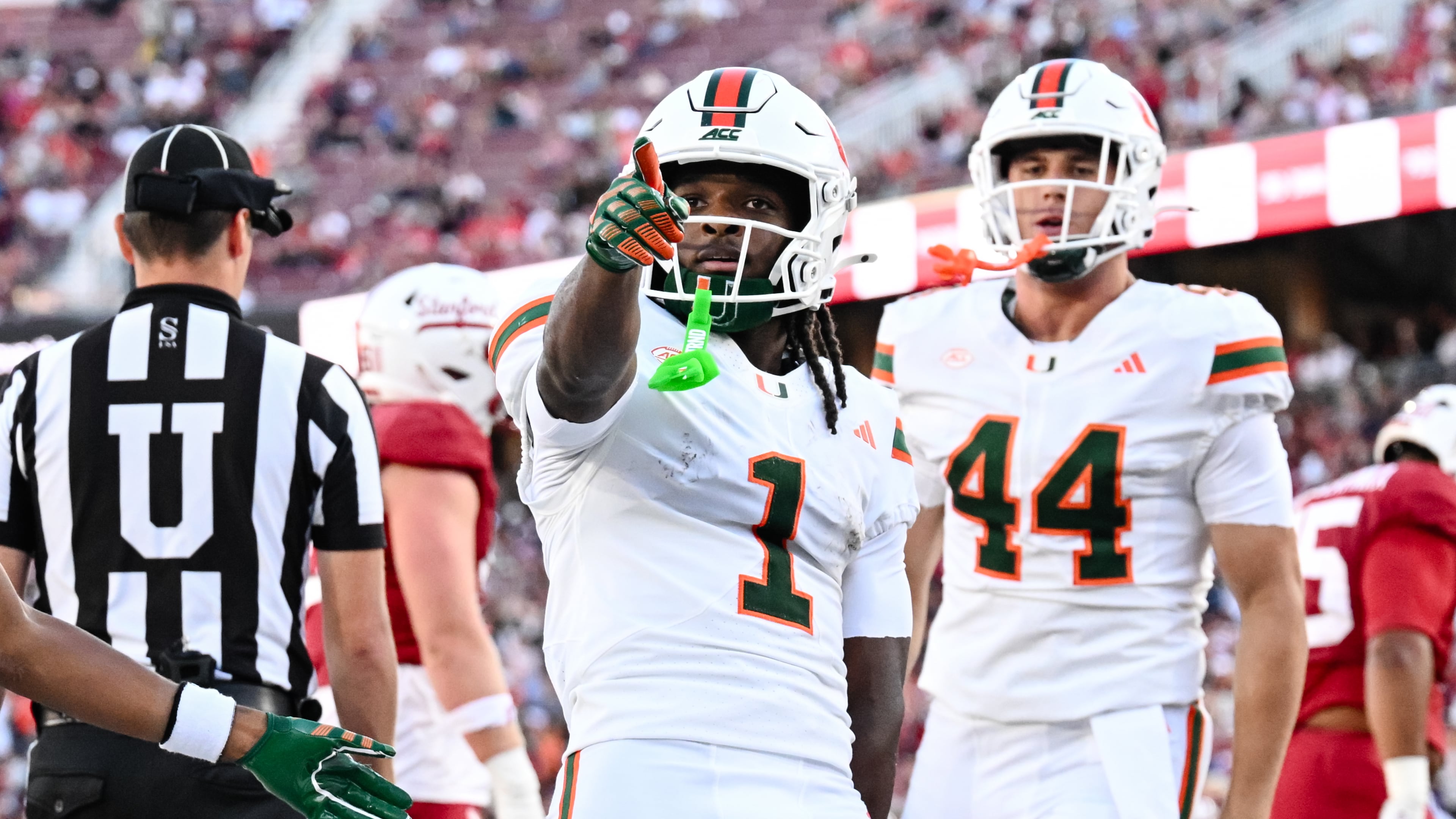 Miami wide receiver Malachi Toney (1) reacts after scoring a touchdown against Stanford during the first half of an NCAA college football game Friday, Sept. 4, 2026, in Stanford, Calif. (AP Photo/Thien-An Troung)