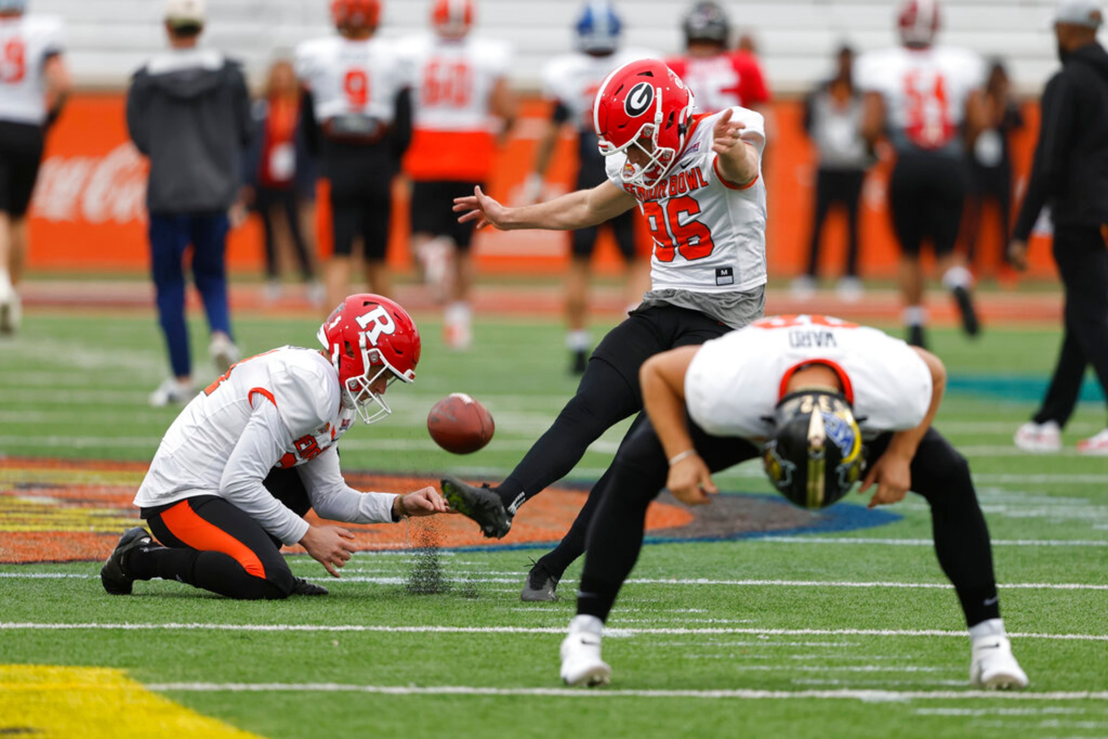 American place kicker Jack Podlesny of Georgia (96) and American Adam Korsak of Rutgers (94) run through drills during practice for the Senior Bowl NCAA college football game Thursday, Feb. 2, 2023, in Mobile, Ala.. (AP Photo/Butch Dill)