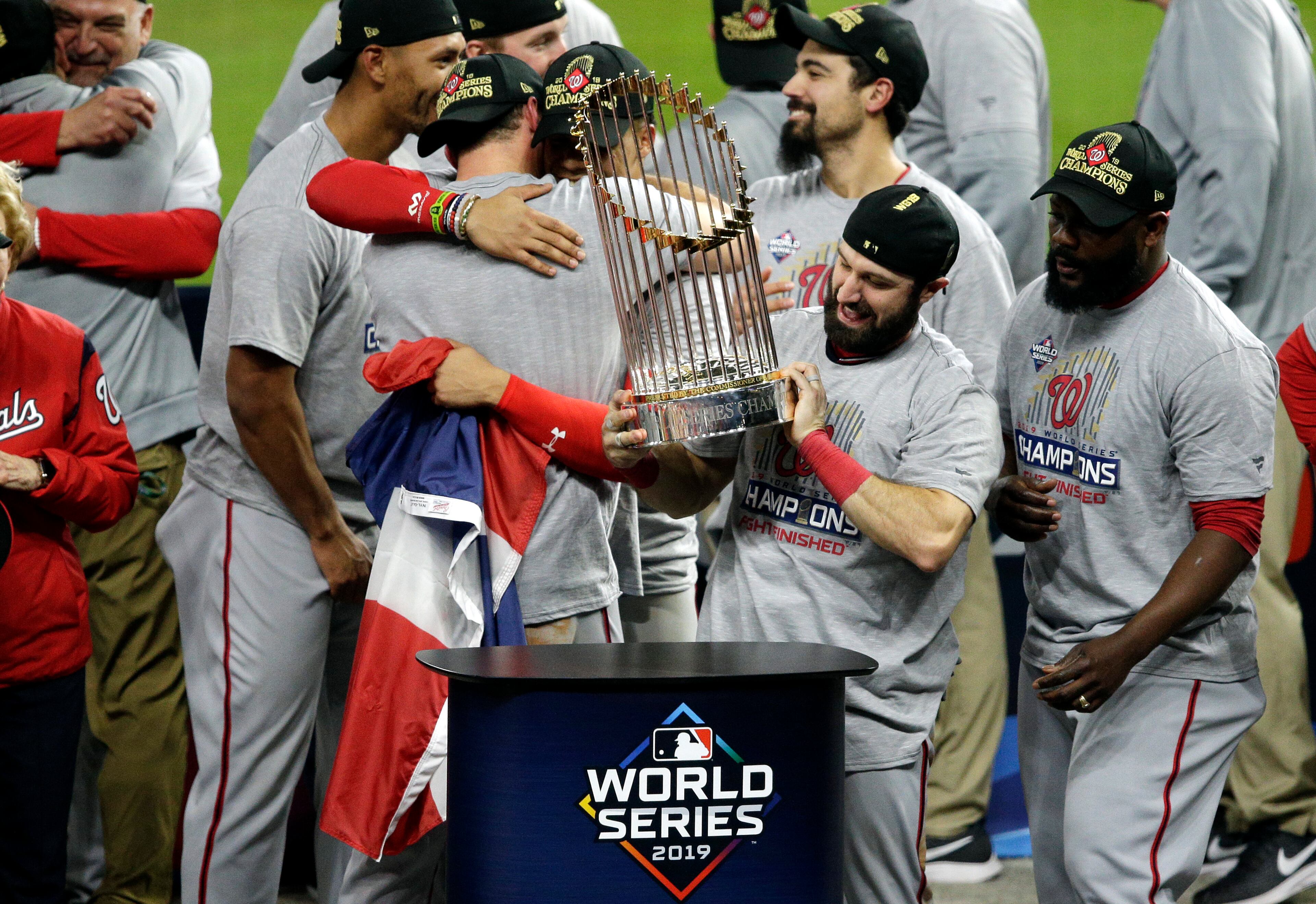 Adam Eaton holds the Commissioners Trophy.