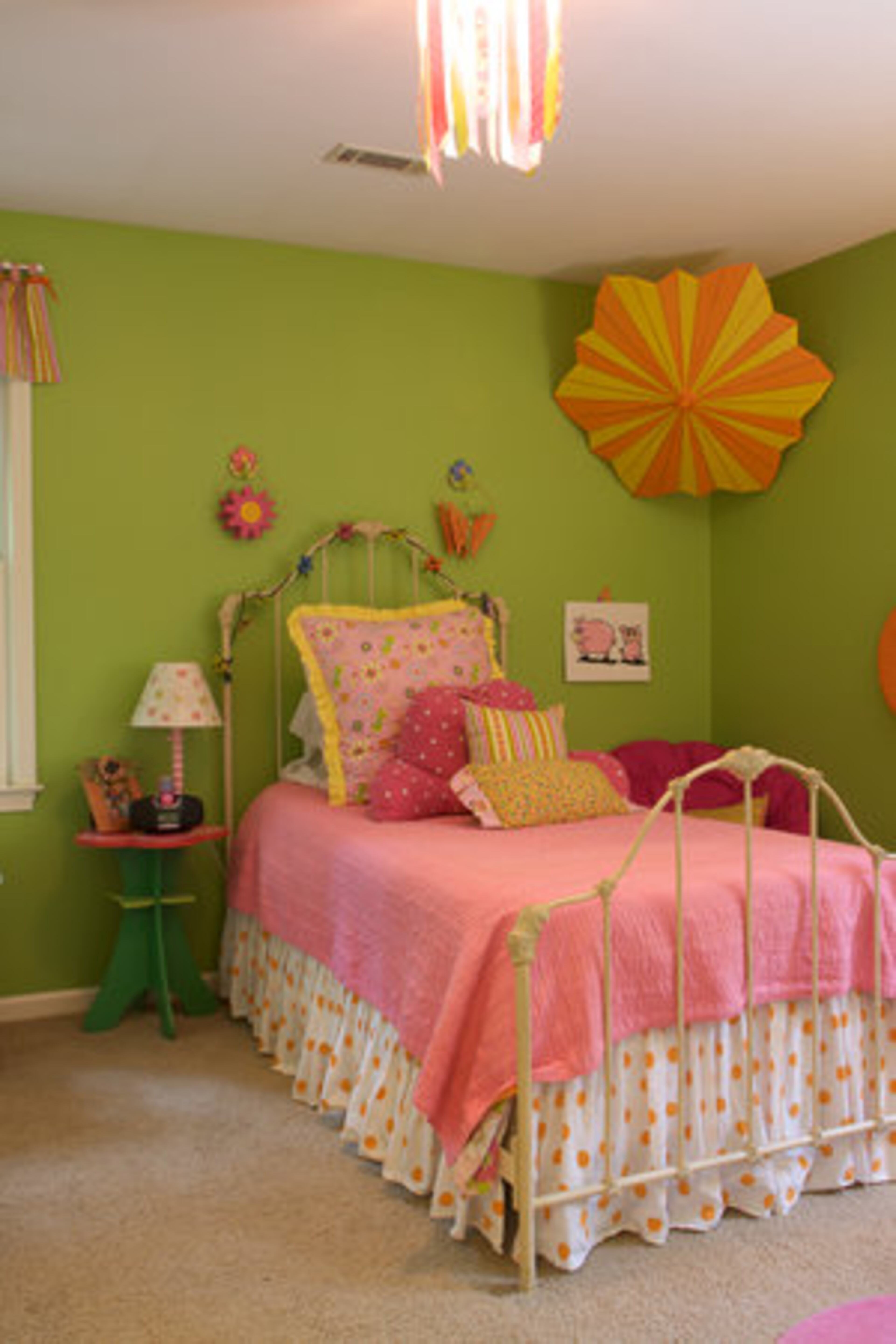 Kate Strickland, 10, loves very bright colors, which is emphasized by the striking patterns featuring bold shades of green, pink, and orange found throughout her bedroom.