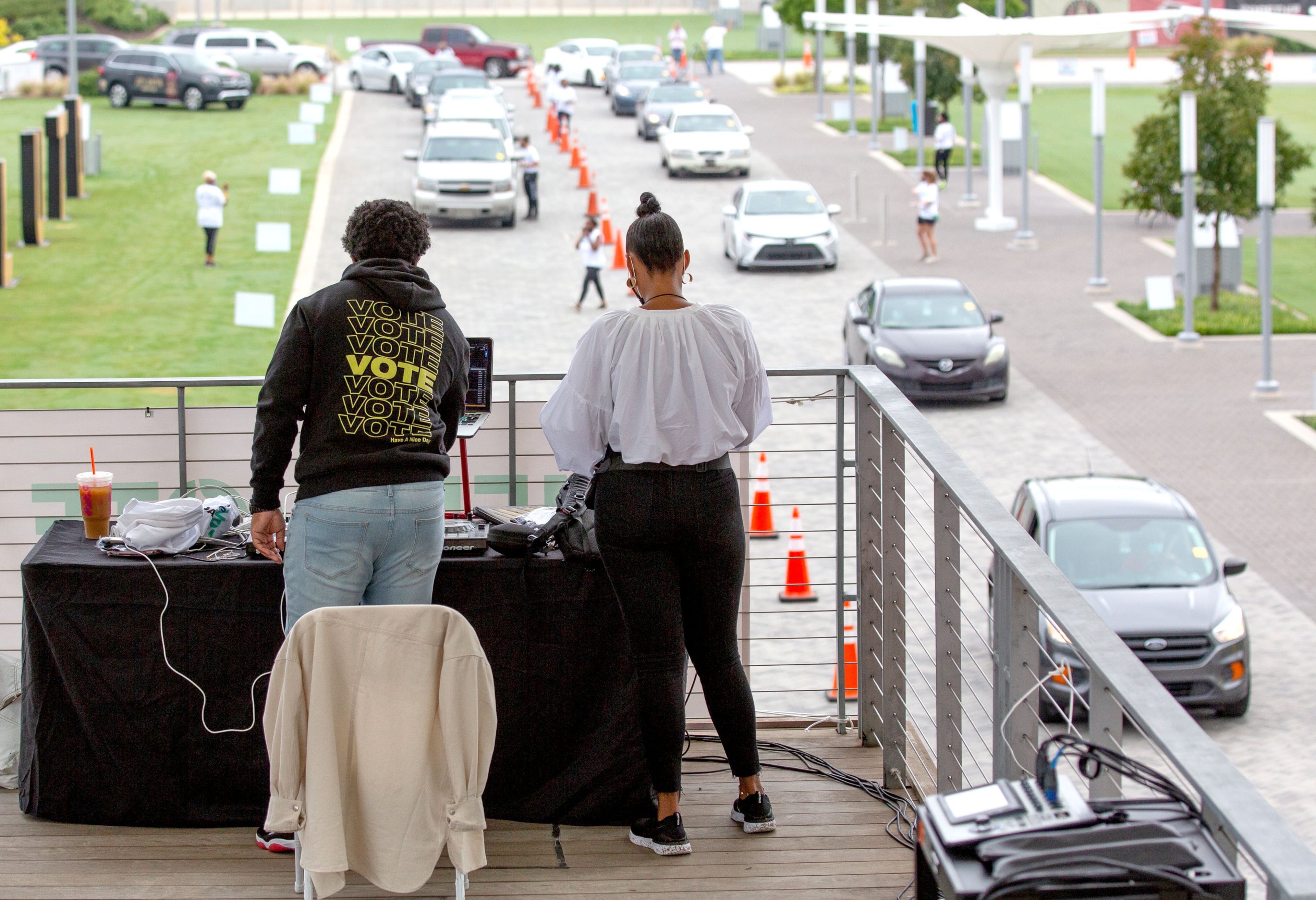 DJ Swanky plays music for the volunteers and attendees at the Fuel the Vote food giveaway and voter registration drive at The Home Depot Backyard in Atlanta on Saturday, September 26, 2020. Sponsored by Michelle Obama's nonprofit organization When We All Vote , the event provided food and groceries to an estimated 2,500 attendees and helped them prepare to cast their ballots in November. STEVE SCHAEFER / SPECIAL TO THE AJC