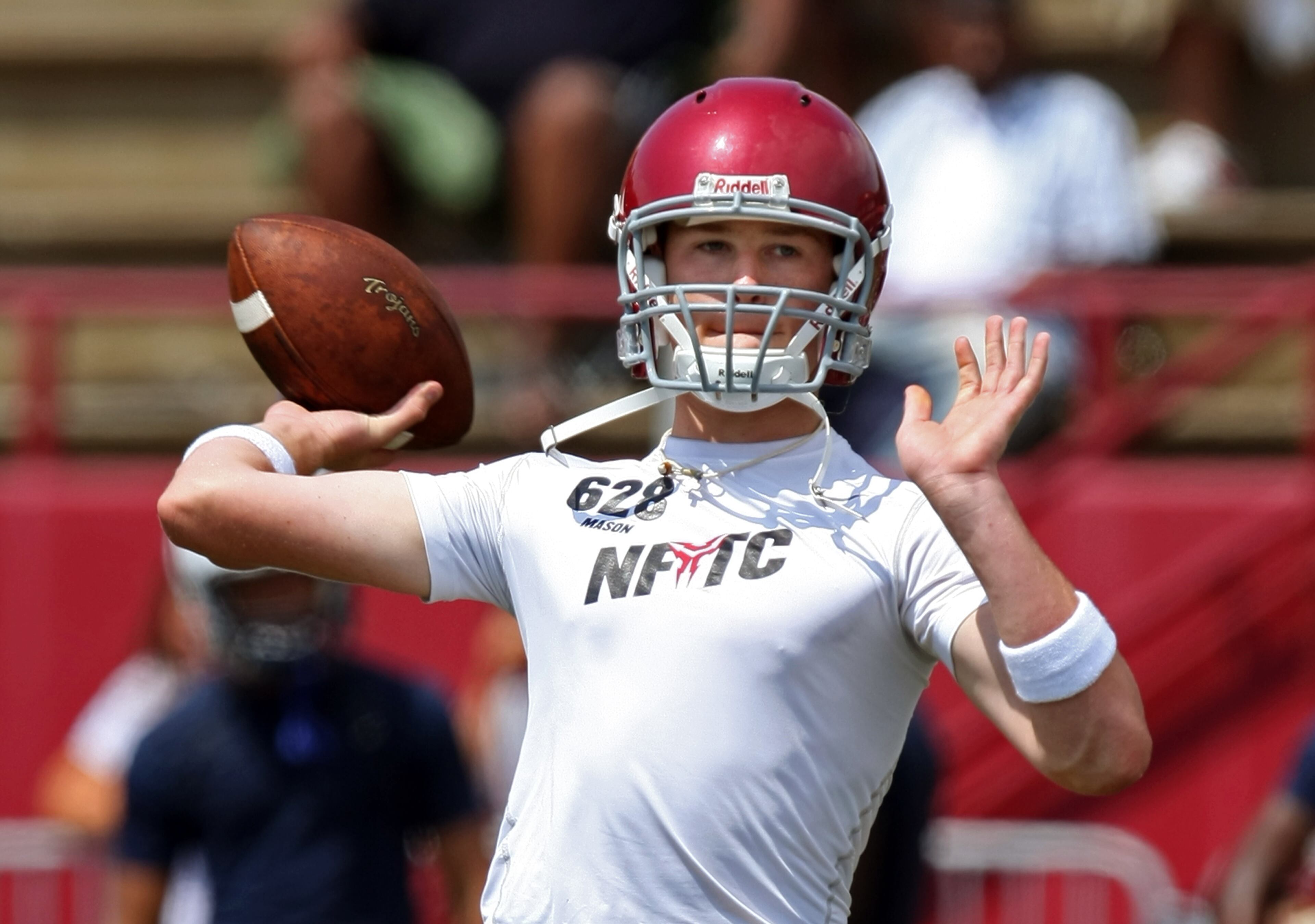 Lassiter quarterback Hutson Mason attempts a pass against South Lake (Fla.) during a high school passing league in Marietta on July 17, 2009.