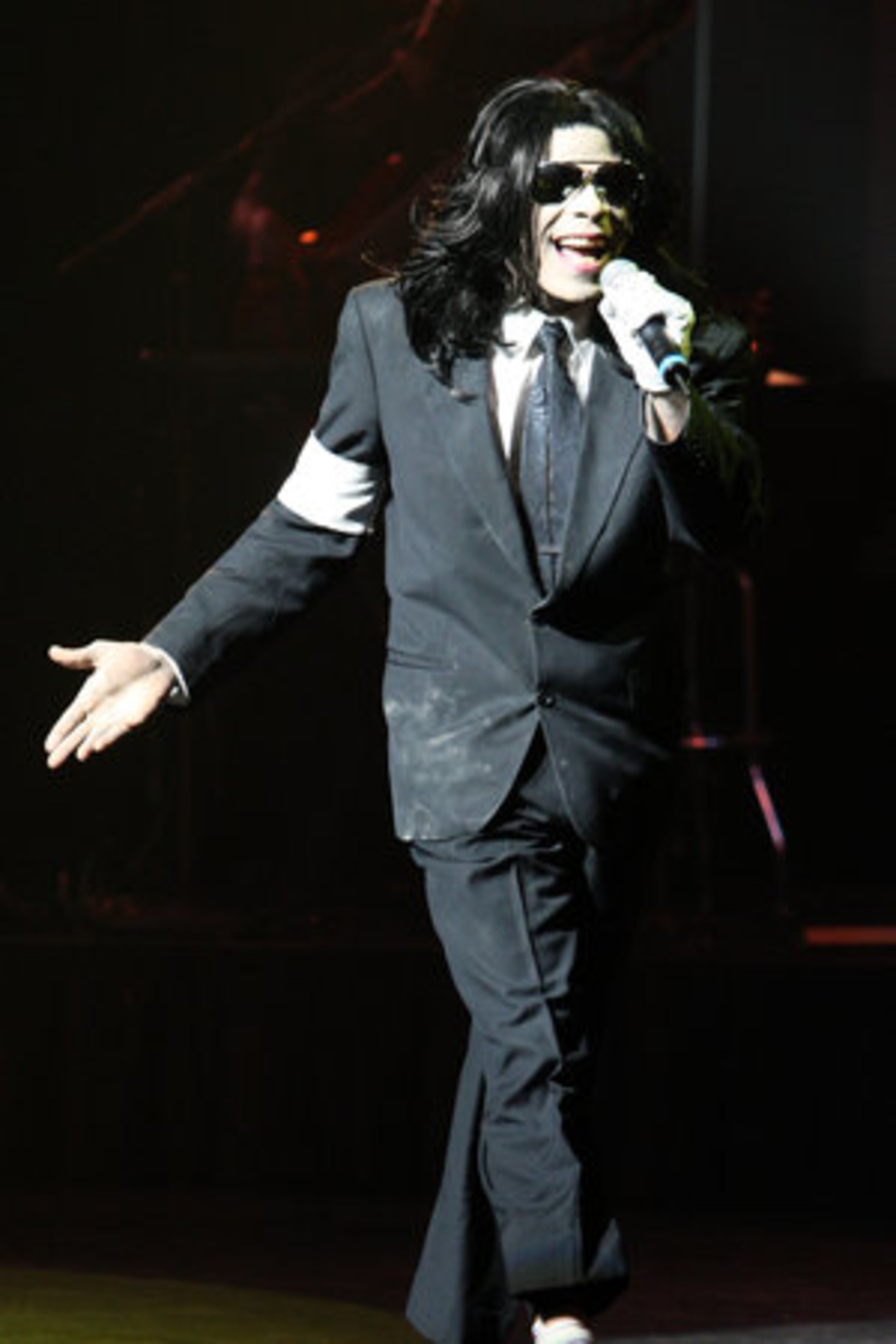 C.P. Lacey came on stage in a black suit, white socks, black wig and sunglasses.