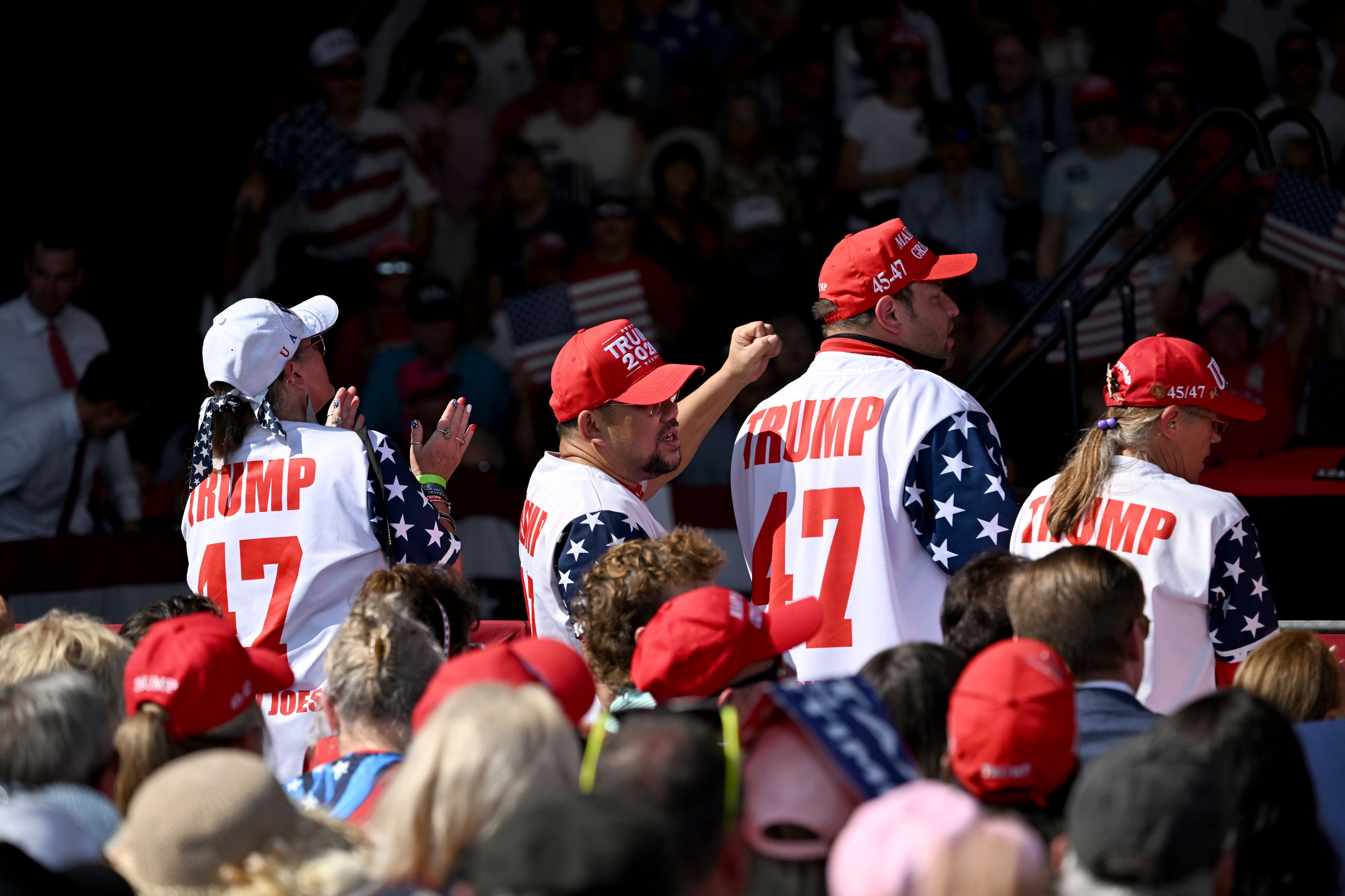 Supporters for President Donald Trump cheer during a campaign rally at Dalton Municipal Airport on Friday, Oct. 16, 2026, in Dalton. (Hyosub Shin/AJC)