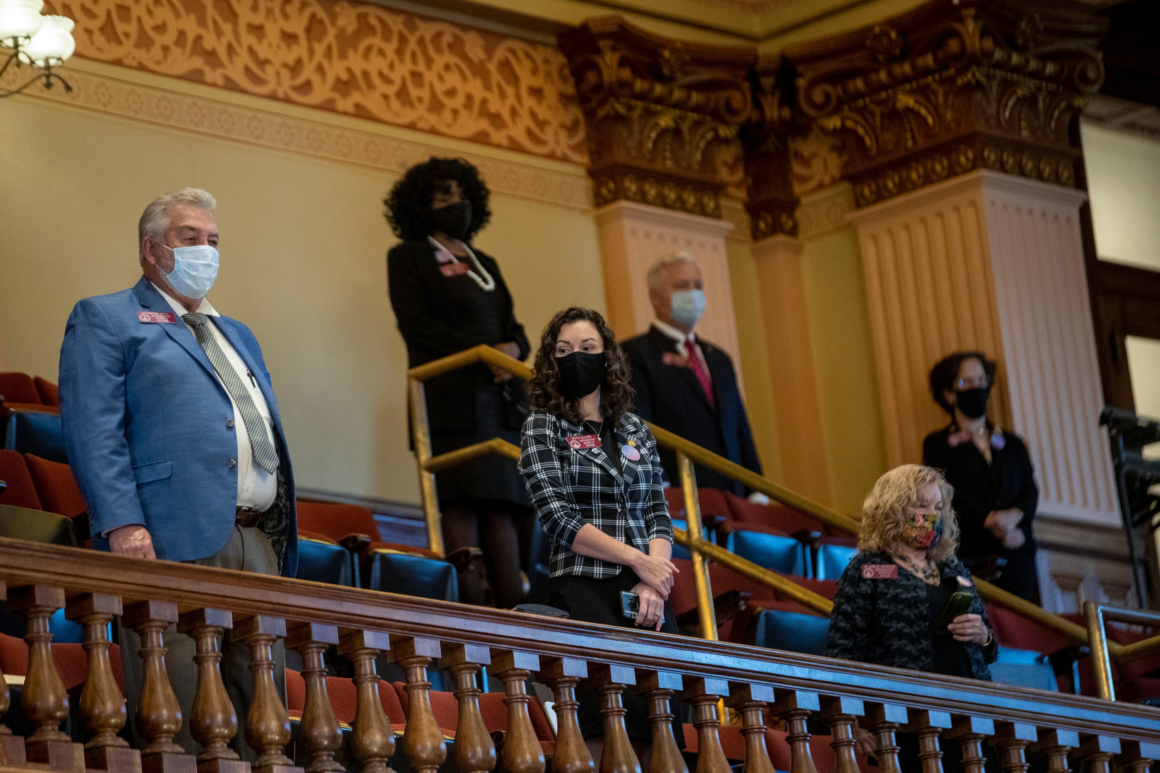 06/15/2020 - Atlanta , Georgia - Members of the Georgia House of Representatives stand in the House gallery during the 30th day of the legislative session at the Georgia State Capitol building, Monday, June 15, 2020. Due to COVID-19 restrictions, members of the house were seated on the floor of the house, the gallery of the house and in the Georgia Senate Committee Room. COVID-19(ALYSSA POINTER / ALYSSA.POINTER@AJC.COM)