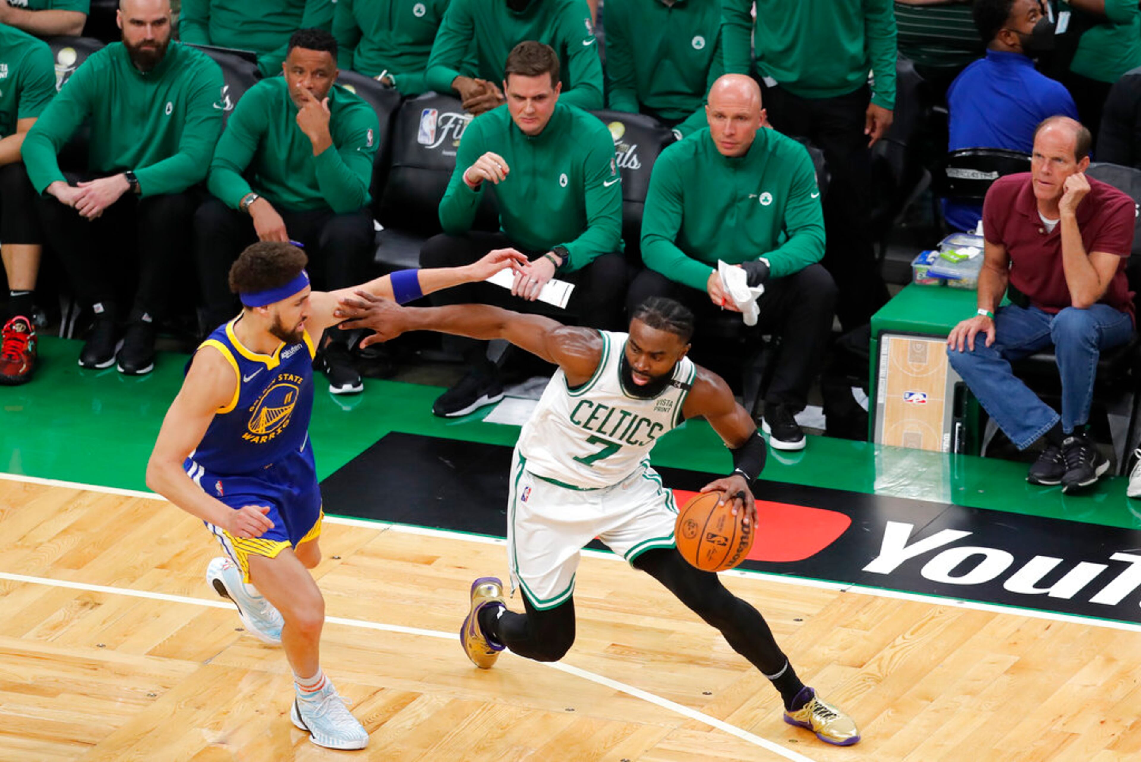 Boston Celtics guard Jaylen Brown (7) drives against Golden State Warriors guard Klay Thompson (11) during the second quarter of Game 6 of basketball's NBA Finals, Thursday, June 16, 2022, in Boston. (AP Photo/Michael Dwyer)