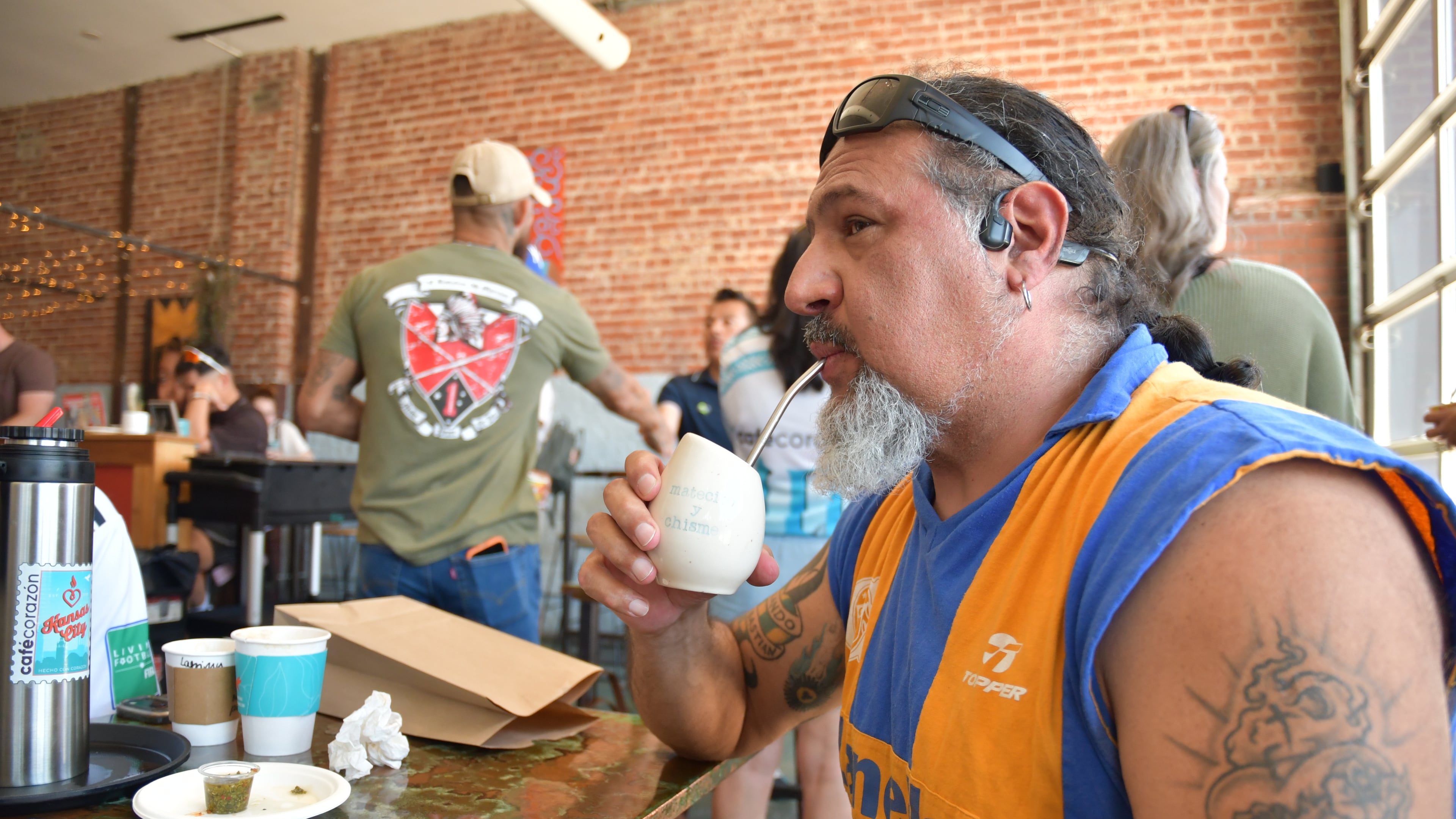 Rene Cufre, of Albuquerque, N.M., sips yerba mate at Cafe Corazon, Monday, June 15, 2026, in Kansas City, Mo. (AP Photo/Kristin M. Hall)