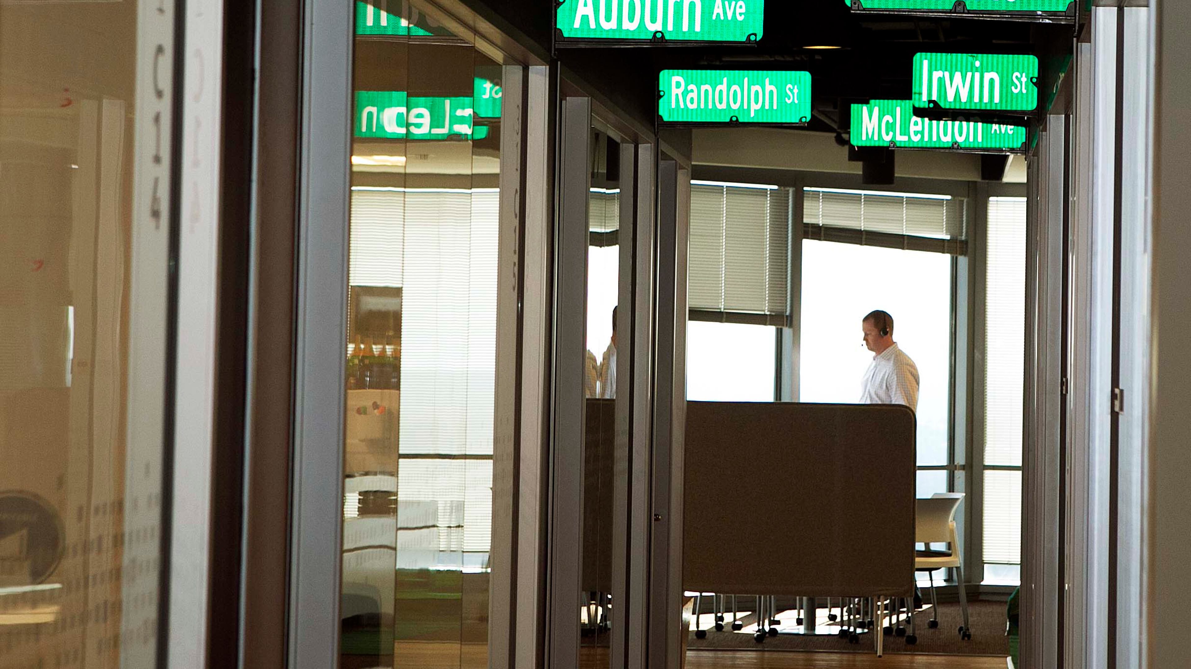 A hallway at Salesforce's Atlanta office is lined with local street signs as part of the fun atmosphere. It was voted the No 1 top workplace for large companies. (Photo by Phil Skinner)