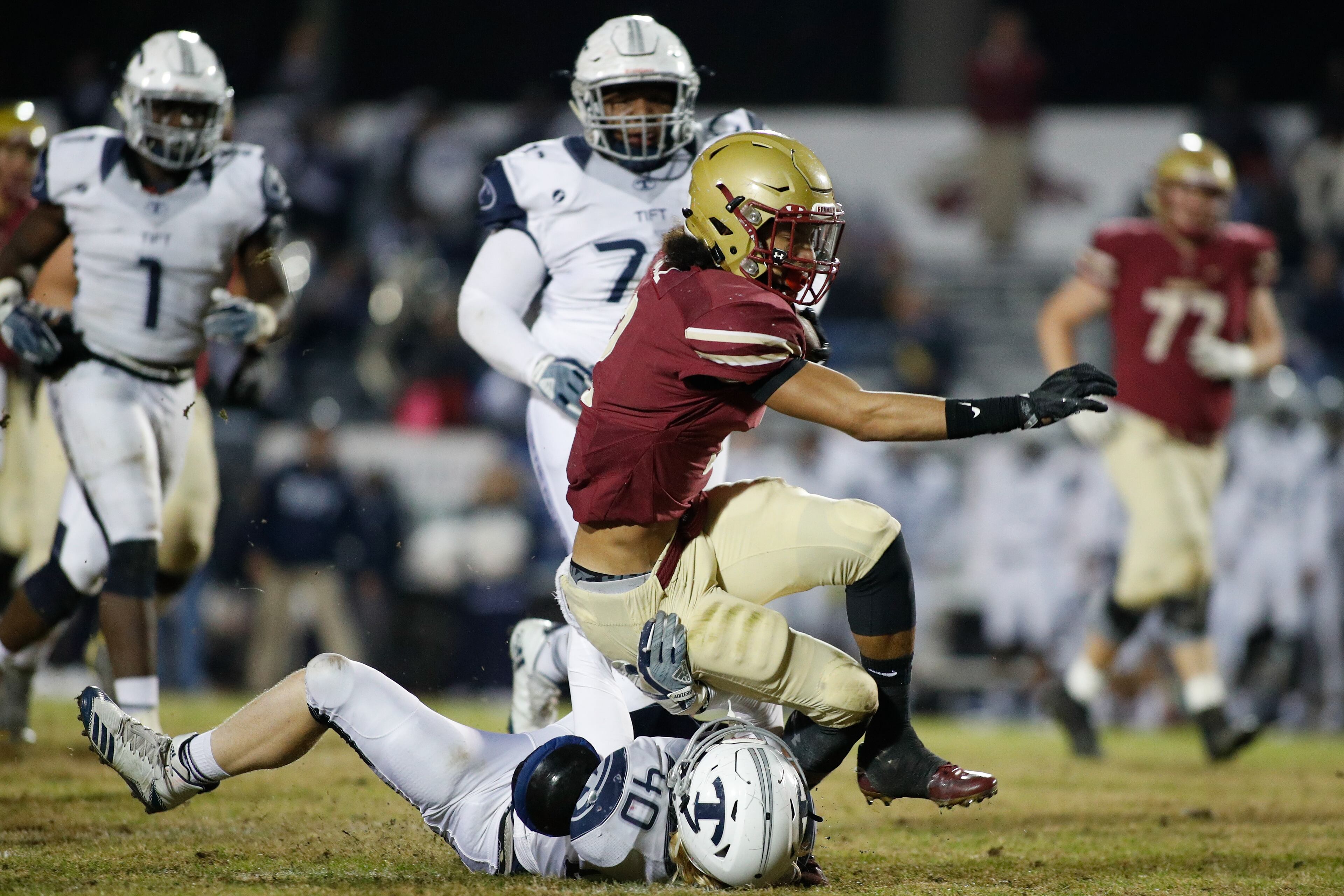 Brookwood's Matthew Hill (2) is tackled by Tift County's Julian Faulk (40) during a GHSA playoff quarterfinal game between Brookwood and Tift County on Friday, Nov. 24, 2017, in Snellville, Ga. (AJ Reynolds/Special)