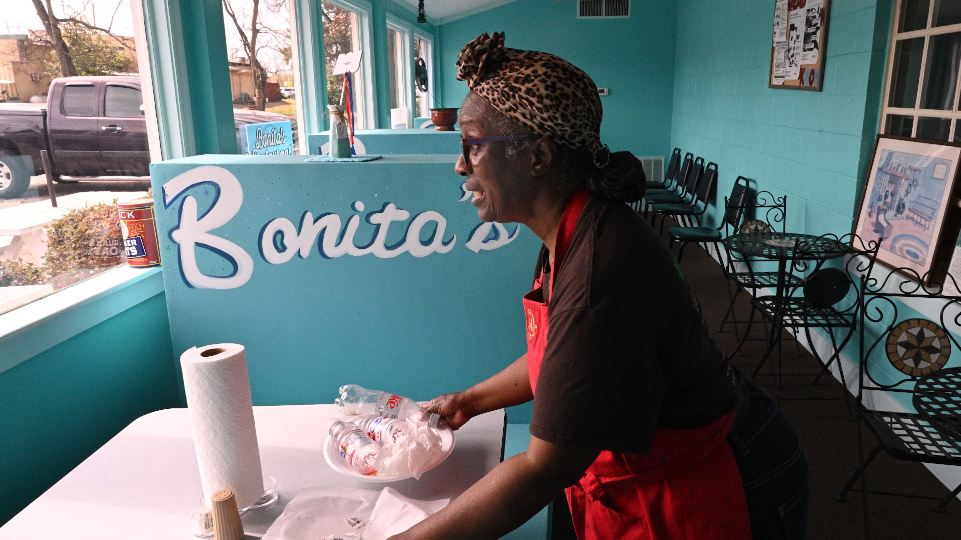 Bonita Hightower, owner of Bonita’s Carry-Out, cleans up a table at Bonita’s Carry-Out in Plains. Hyosub Shin/AJC