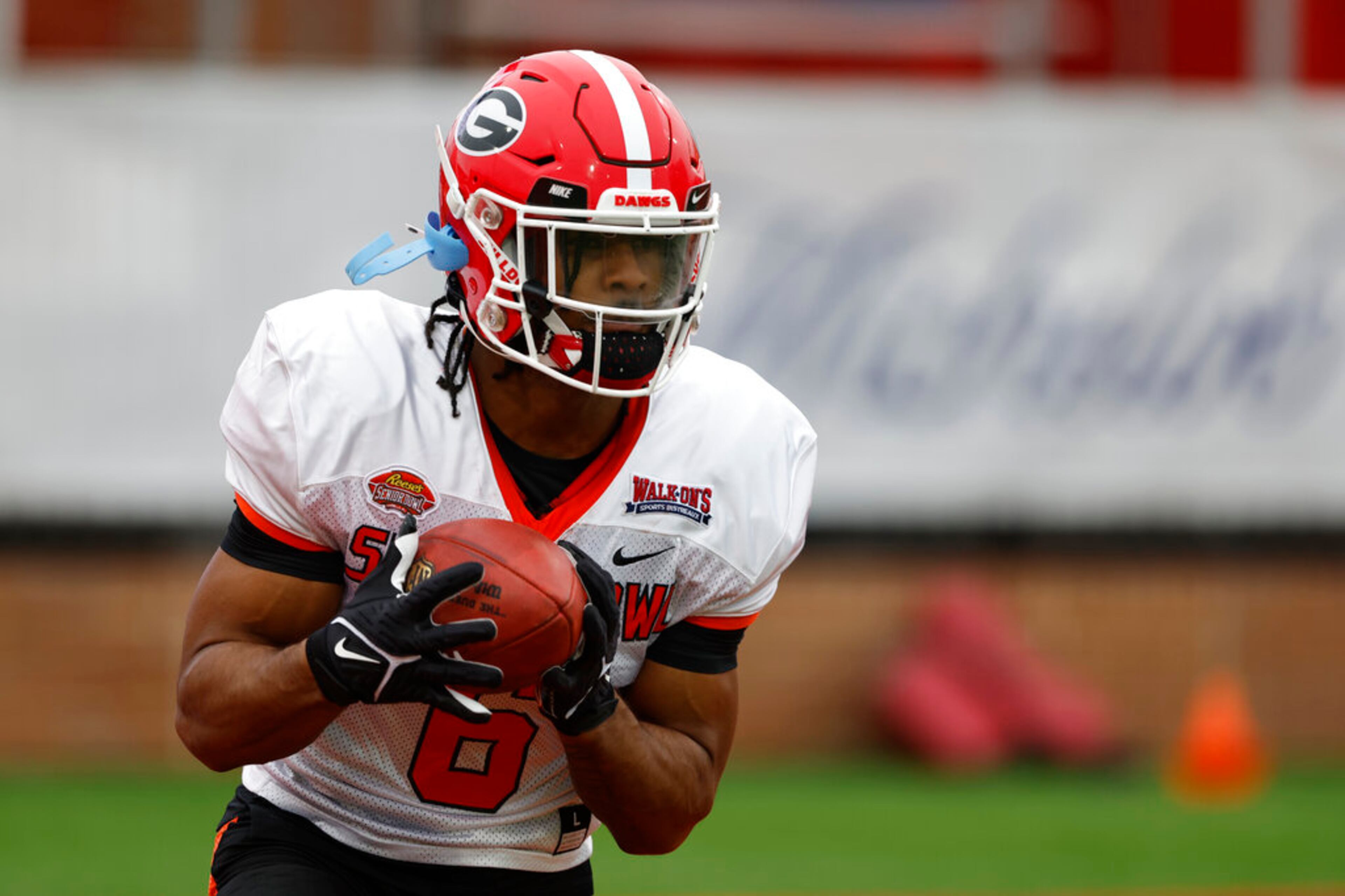 American running back Kenny McIntosh of Georgia (6) runs through drills during practice for the Senior Bowl NCAA college football game Thursday, Feb. 2, 2023, in Mobile, Ala.. (AP Photo/Butch Dill)