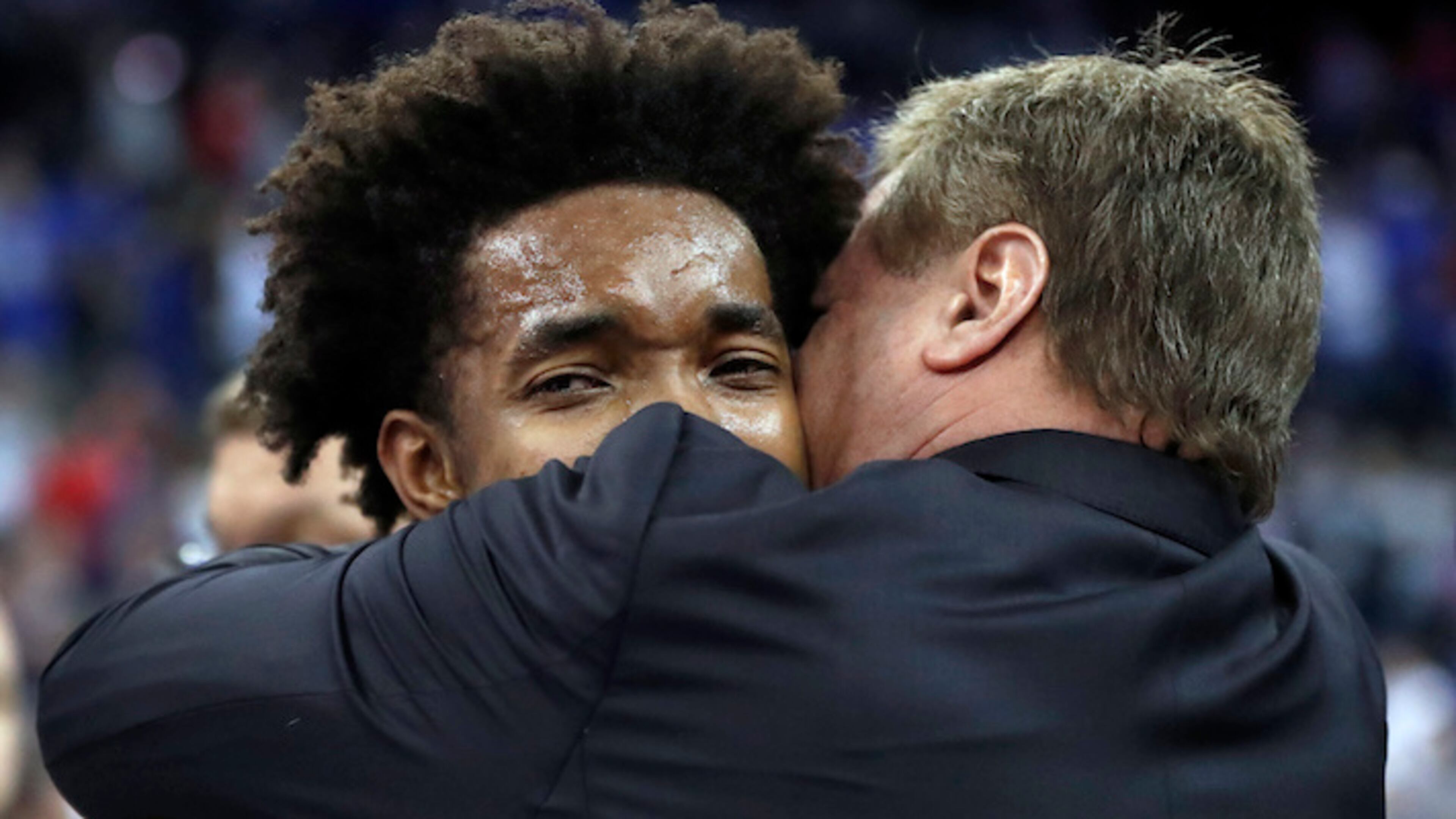 Kansas head coach Bill Self, right, hugs Devonte' Graham following a regional final game against Duke in the NCAA men's college basketball tournament Sunday, March 25, 2018, in Omaha, Neb. Kansas won 85-81 in overtime. (AP Photo/Nati Harnik)