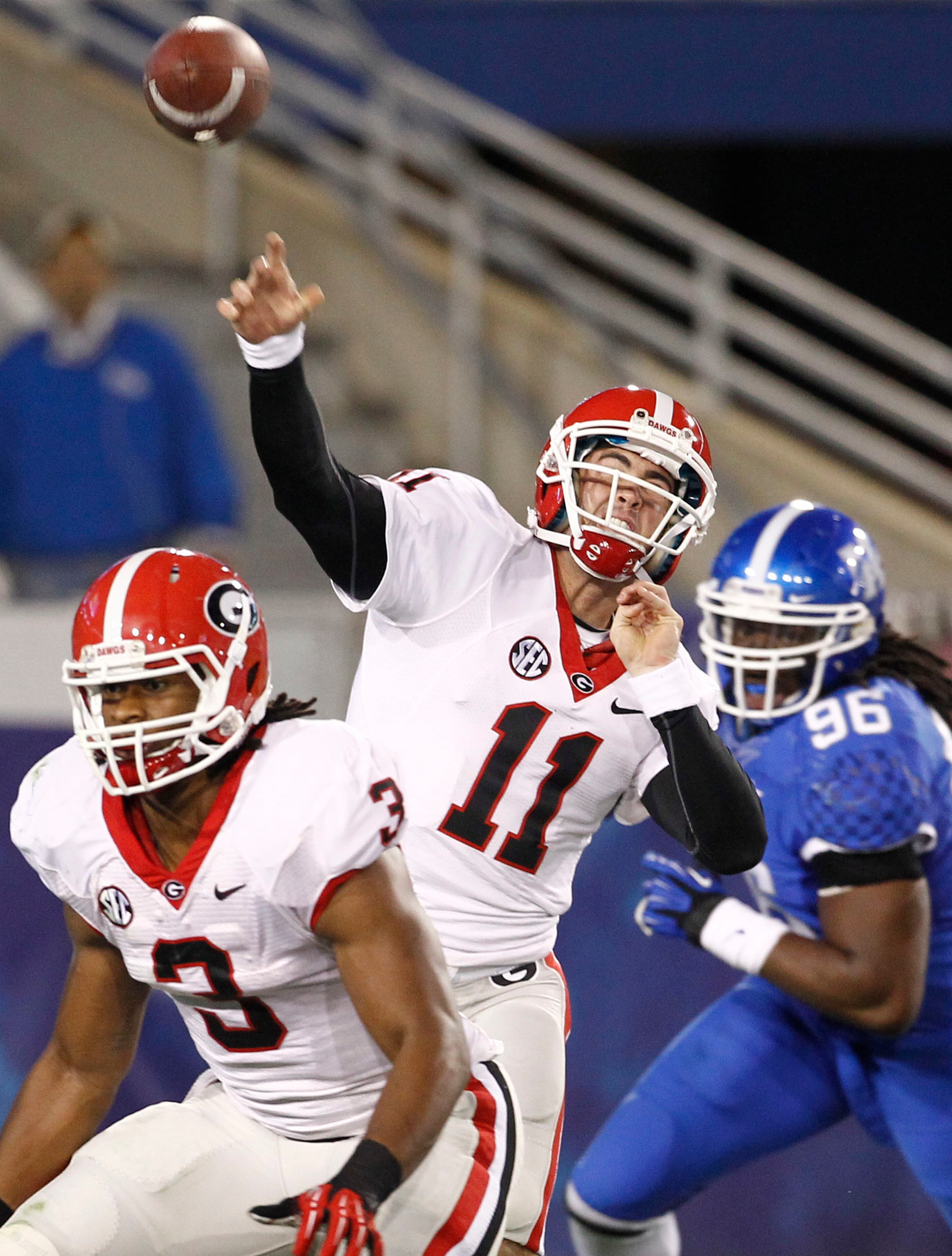 Georgia Bulldogs quarterback Aaron Murray (11) threw downfield against Kentucky. Murray set the UGA career touchdown record in the first half. With four Saturday he now has 75 in his career, three better than David Greene. Murray finsihed with 427 yards on 31-of-37 passing.