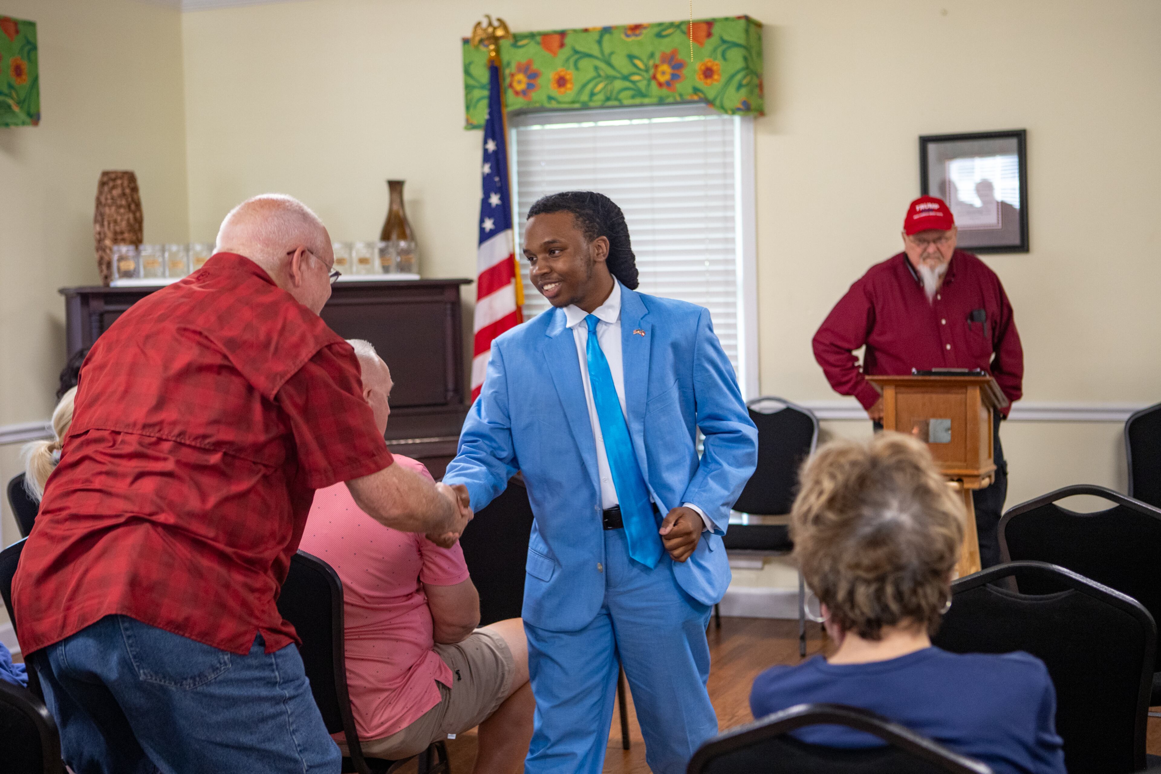 Ja'Quon Stembridge speaks at a Henry County Republican Party meeting Tuesday, where lines of attendees formed to congratulate the newly elected assistant secretary. (Jenni Girtman for the AJC)