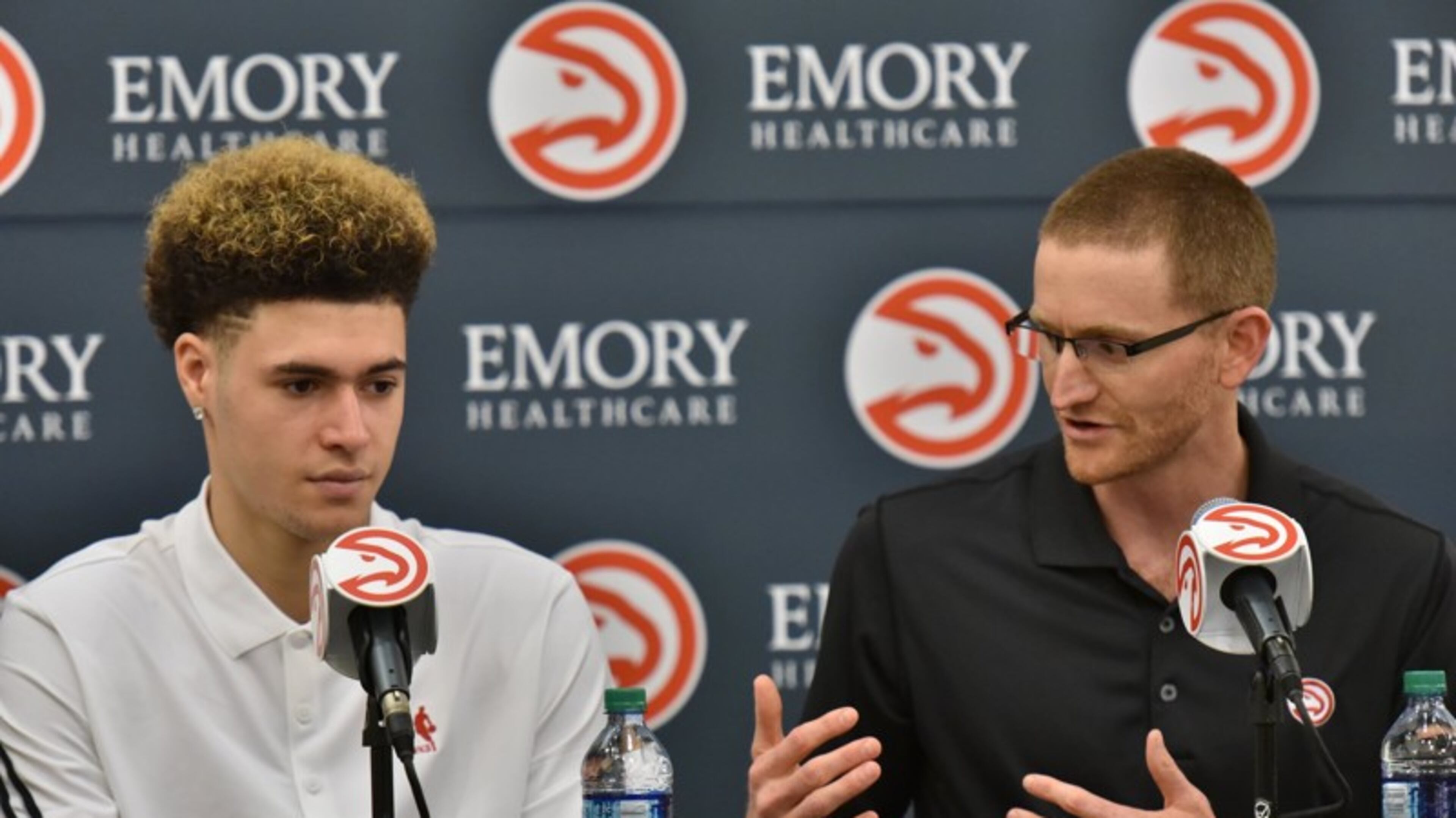 Atlanta Hawks general manager Wes Wilcox speaks as Isaia Cordinier sits next him during a press conference on Tuesday, June 28, 2016.
