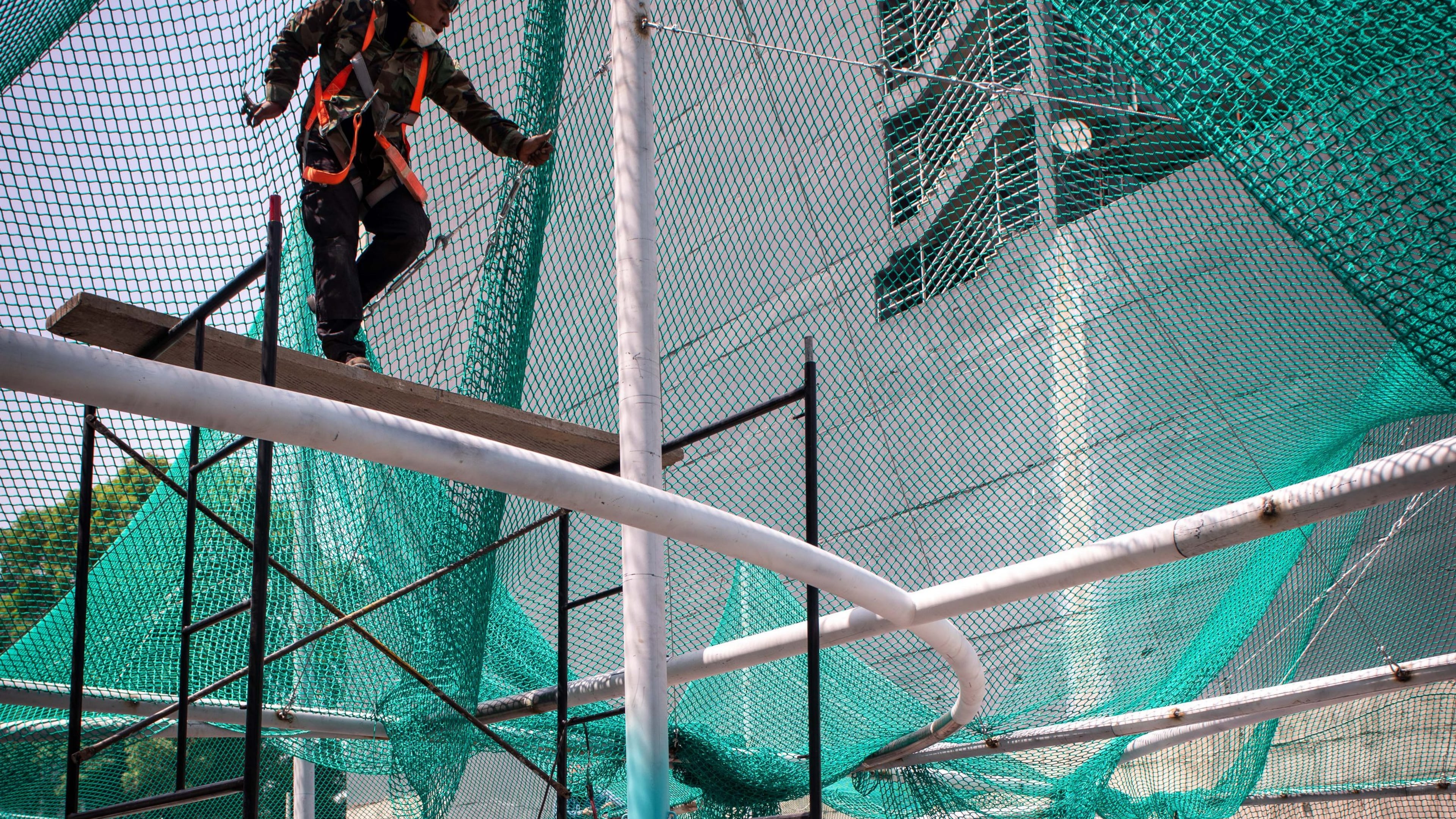 A worker assembles part of a structure similar to the "Murmuration" installation that will open at the High Museum July 17. CONTRIBUTED: JAIME NAVARRO