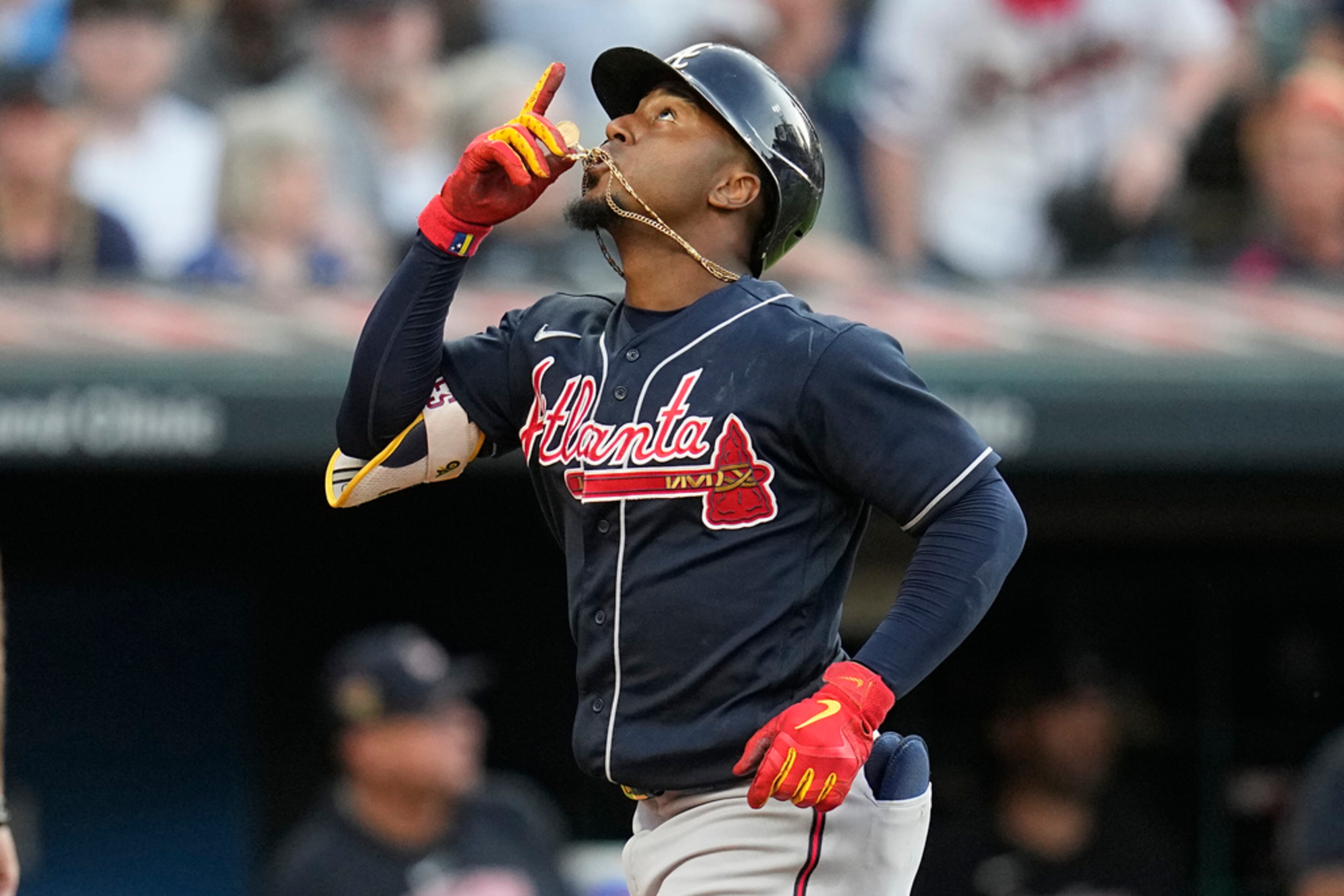 Atlanta Braves' Ozzie Albies gestures as he runs to home plate with a two-run home run against the Cleveland Guardians during the fifth inning of a baseball game Tuesday, July 4, 2023, in Cleveland. (AP Photo/Sue Ogrocki)