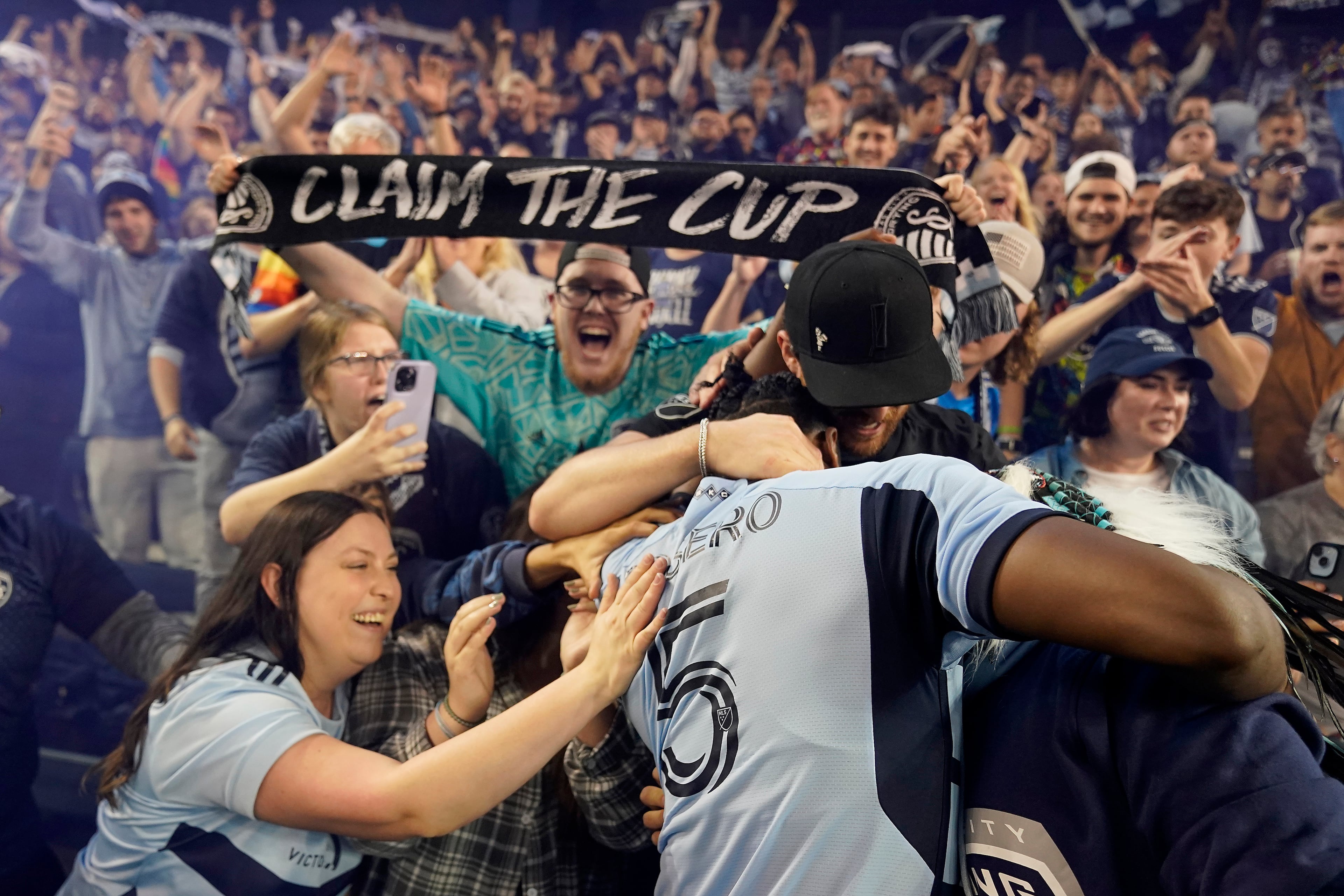 Fans celebrate with Sporting Kansas City defender Dany Rosero after an MLS soccer wild-card playoff match against the San Jose Earthquakes Wednesday, Oct. 25, 2023, in Kansas City, Kan. Sporting Kansas City won in a penalty shootout to advance to the playoffs. (Charlie Riedel/AP)