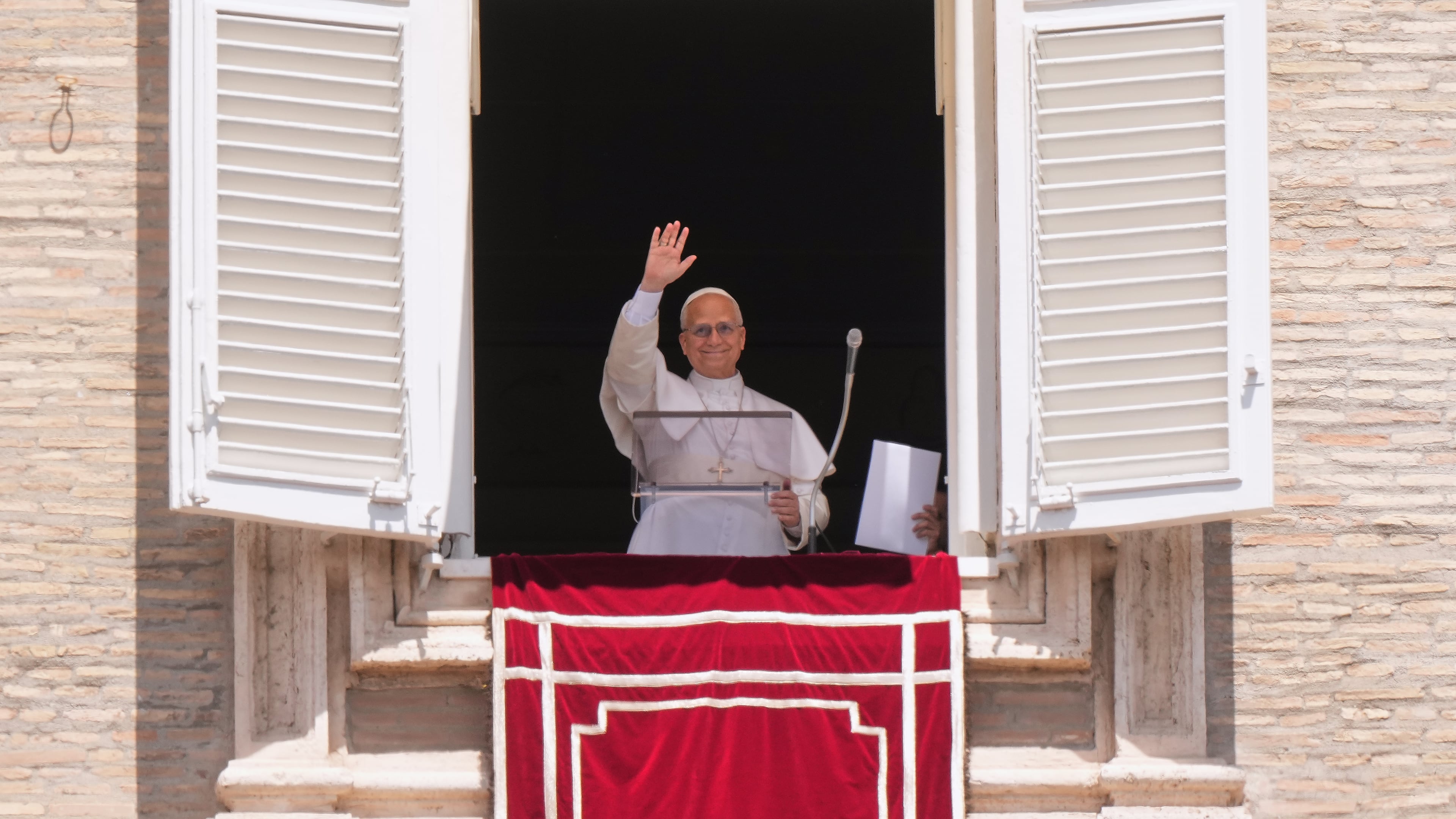 Pope Leo XIV delivers his blessing as he recites the Regina Coeli noon prayer from the window of his studio overlooking St. Peter's Square, at the Vatican, Sunday, May 17, 2026. (AP Photo/Andrew Medichini)