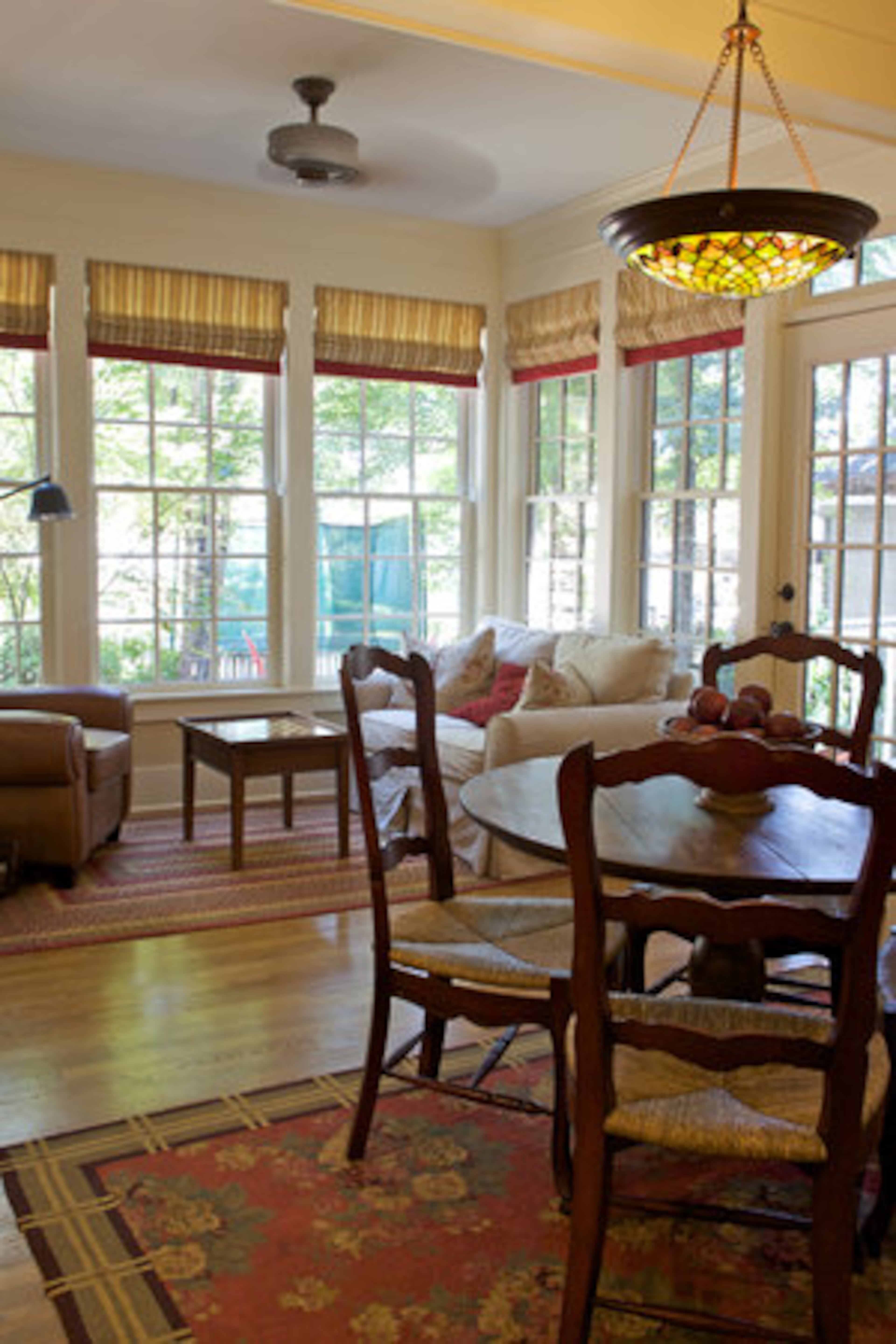 "When we first began with design ideas for the sunroom, it was originally only going to be a mudroom and laundry room," Todd Strickland says. "As we started talking more about the project, we thought about the idea of bringing the outdoors into the house. Now we're able to spend time inside while enjoying the outdoors as much as possible."